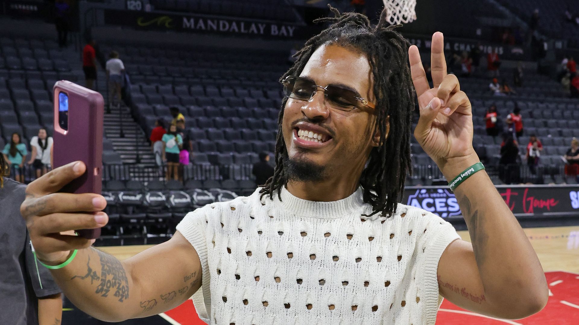 Photo shows TikTok star Keith Lee taking a selfie on a basketball court