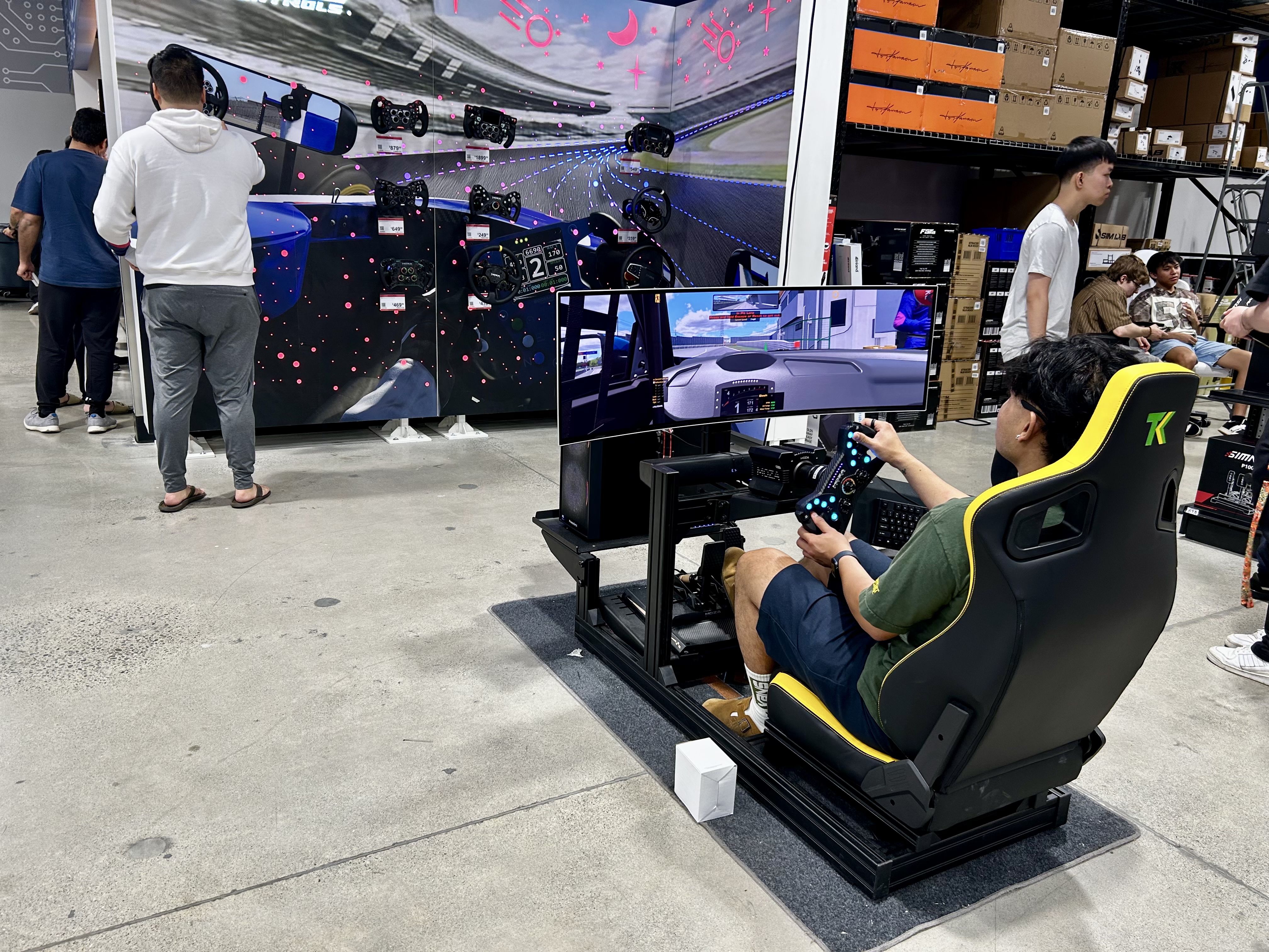 Photo of a customer trying out a gaming chair and console