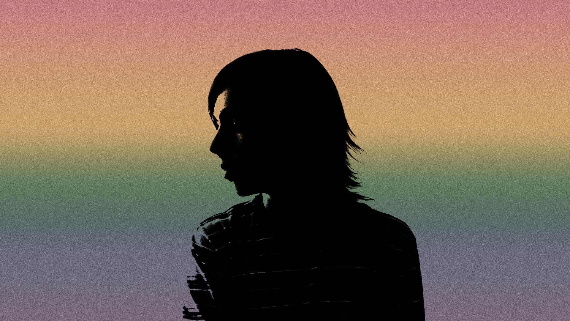 Illustration of the colors of the LGBTQ Pride flag projected over the silhouette of a teenager.
