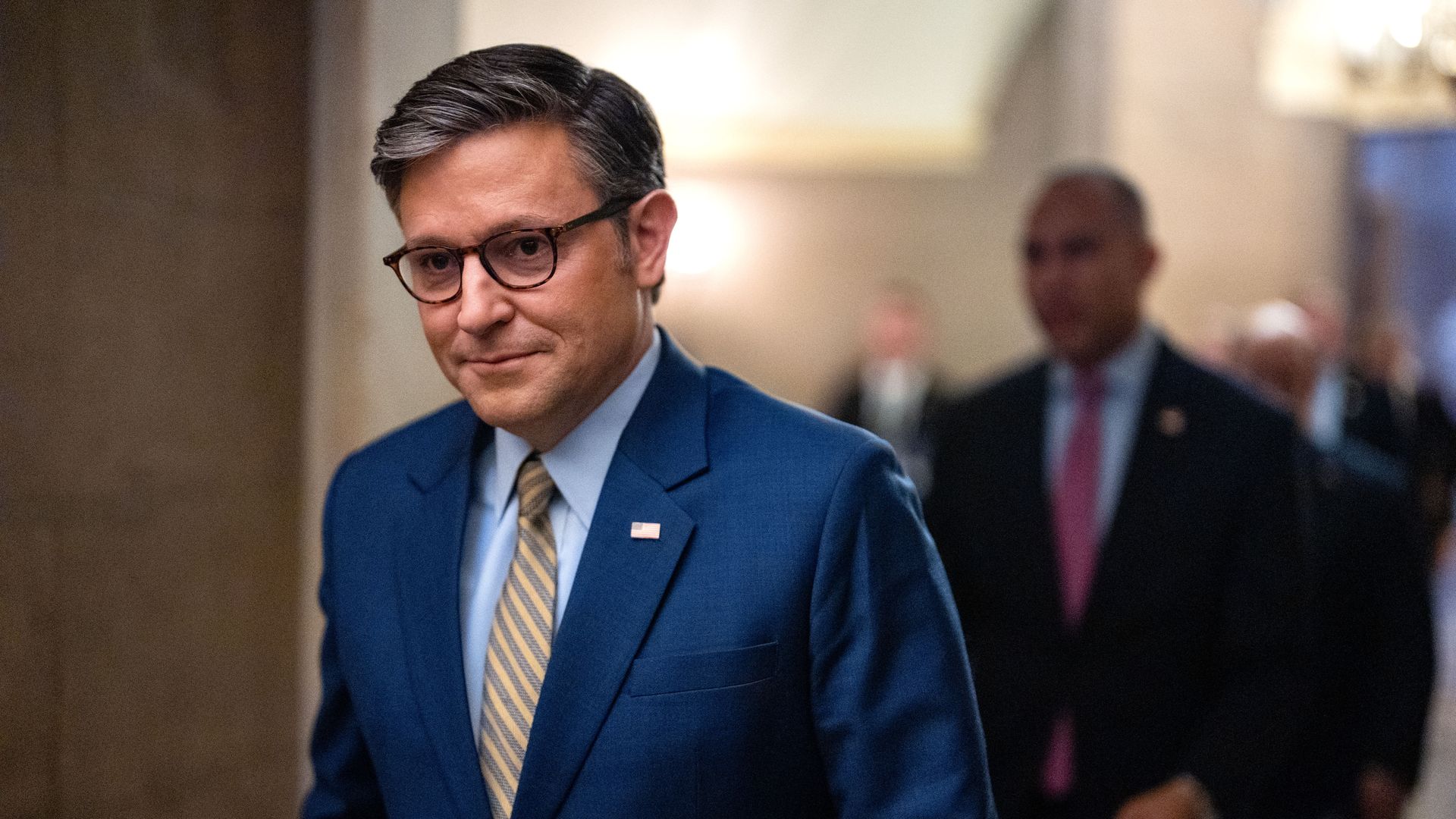 House Speaker Johnson walks through Capitol Hill before an event.