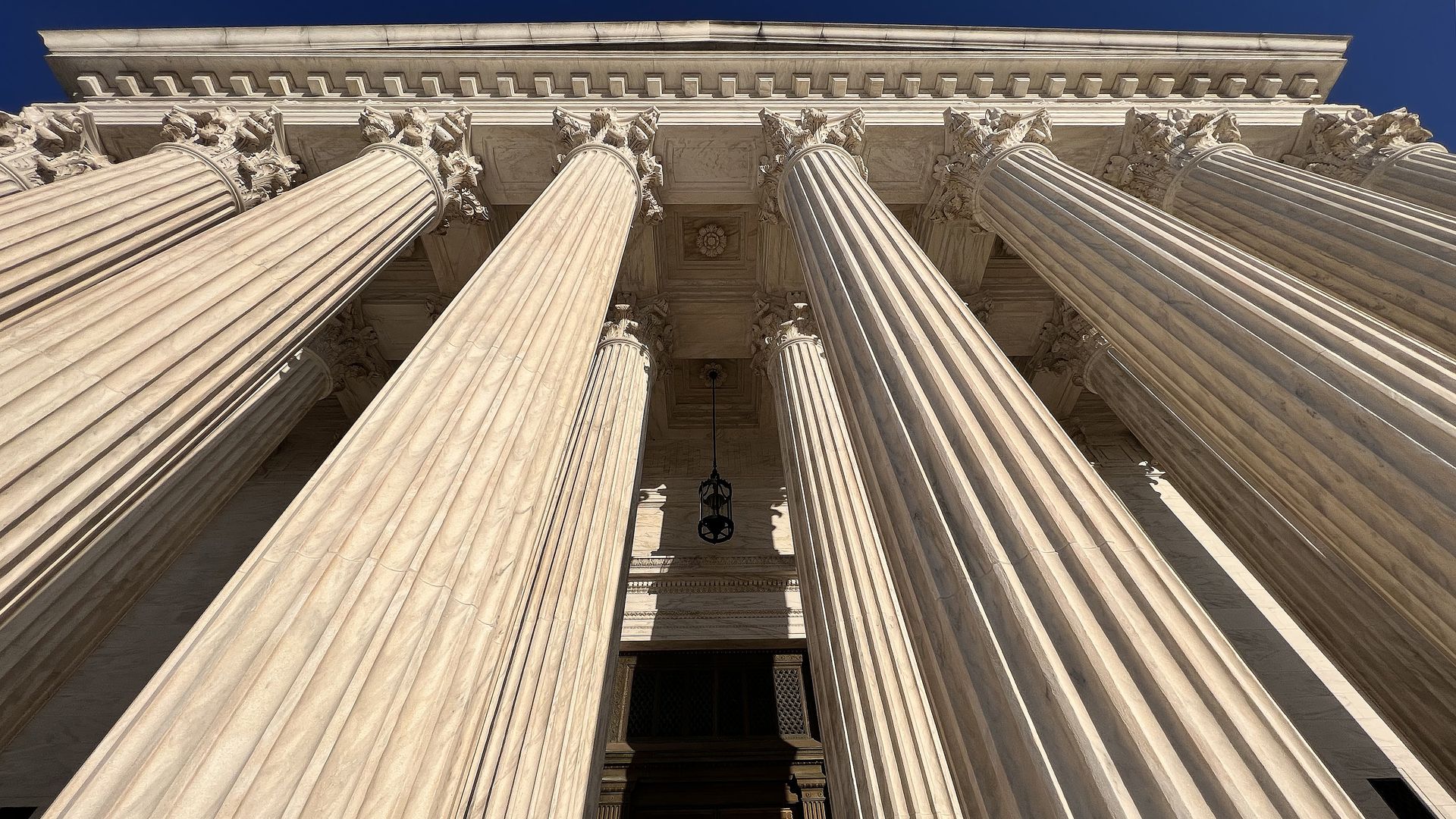 The Supreme Court pillars are seen from below.