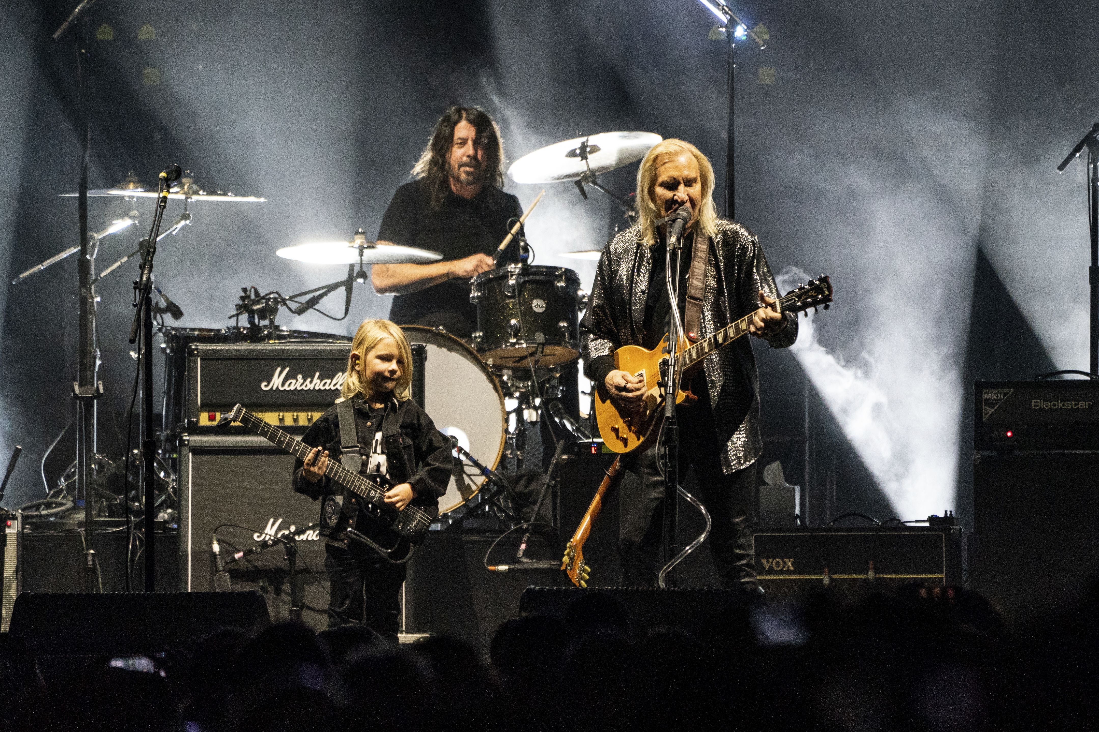 Dave Grohl drums and Joe Walsh plus Roy Orbison III play guitar on stage at Nationwide Arena. 