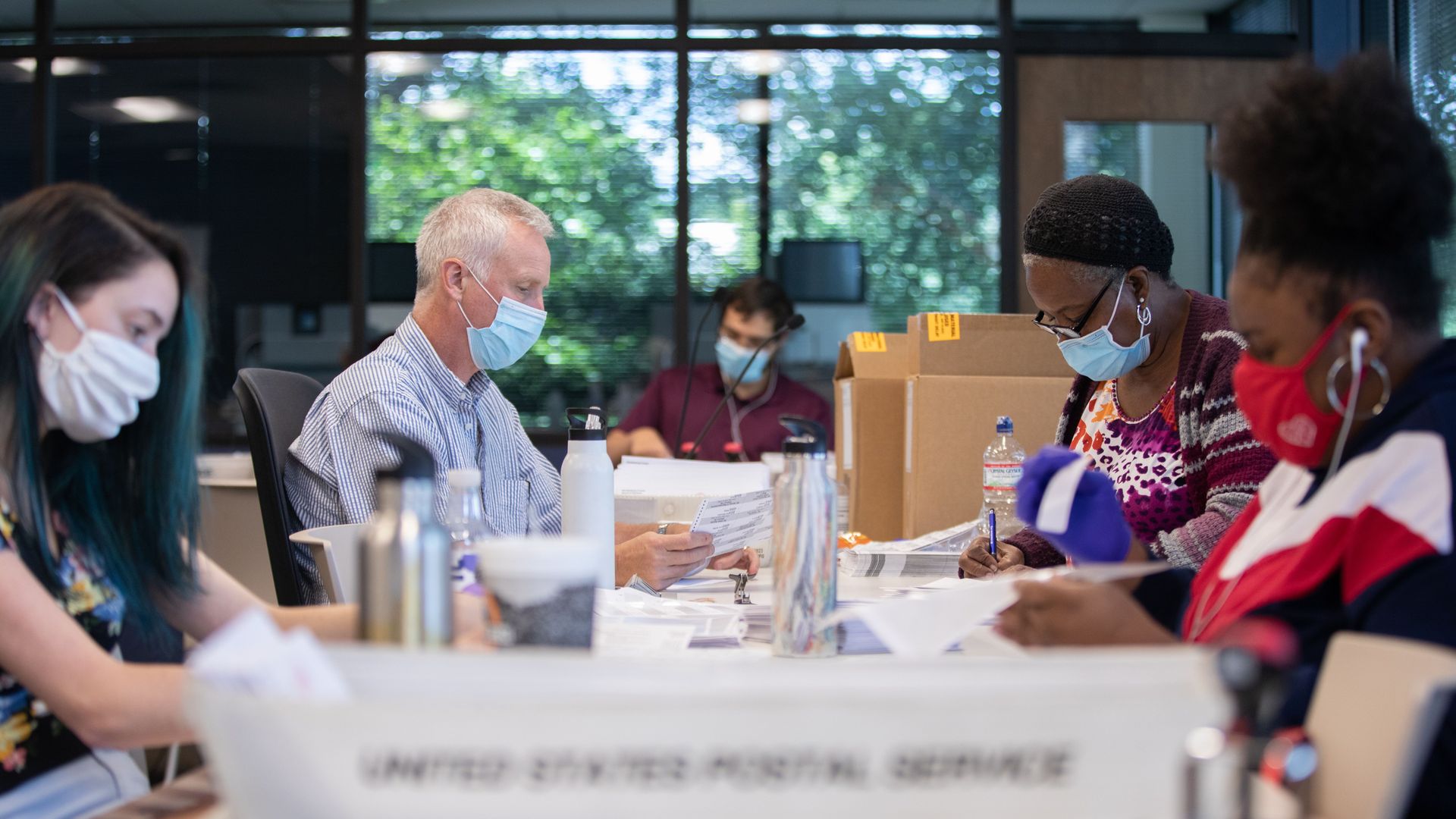 Poll workers count Absentee ballots