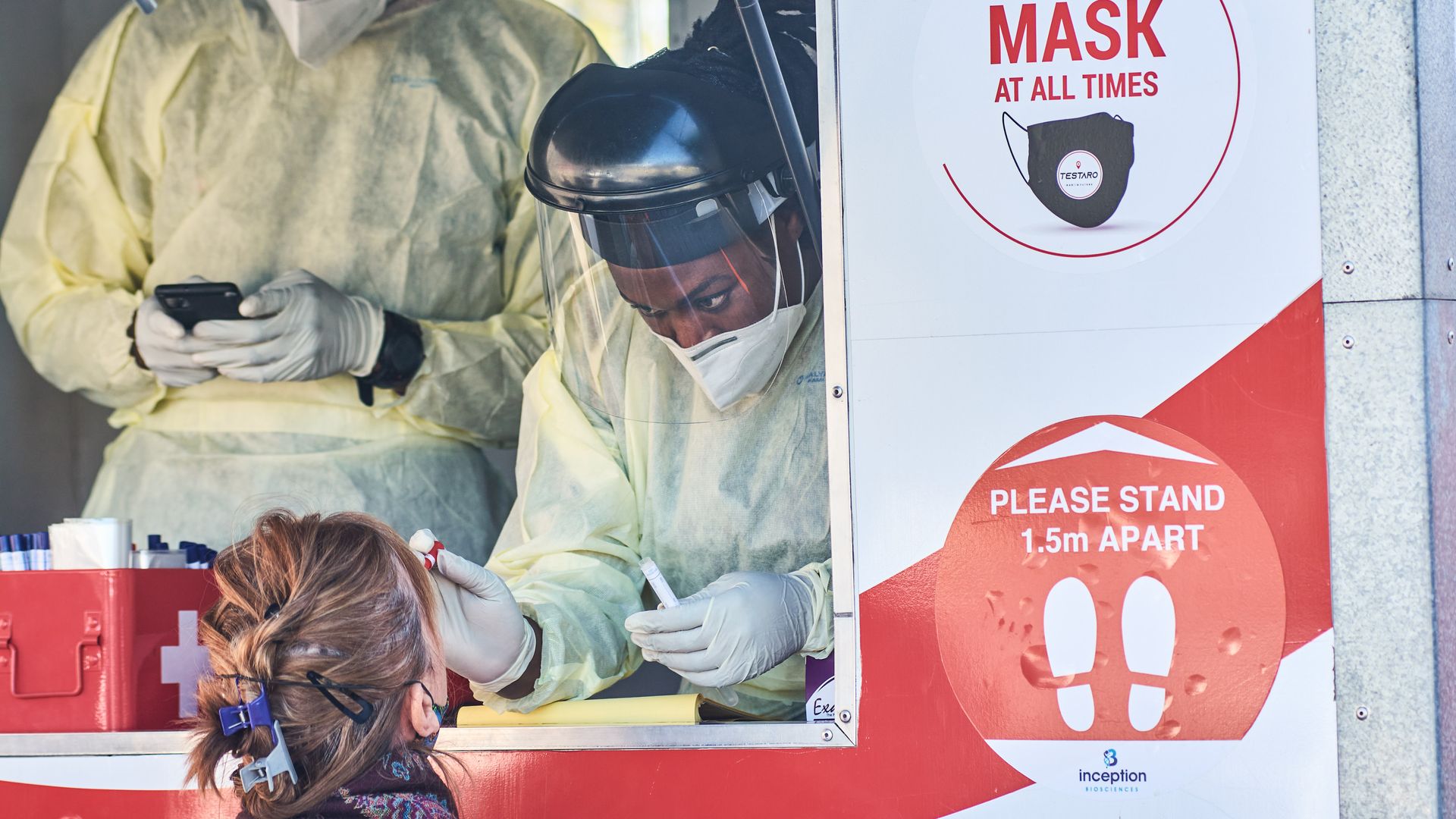 A health worker administers a COVID test in a suburb of Johannesburg, South Africa, in July.