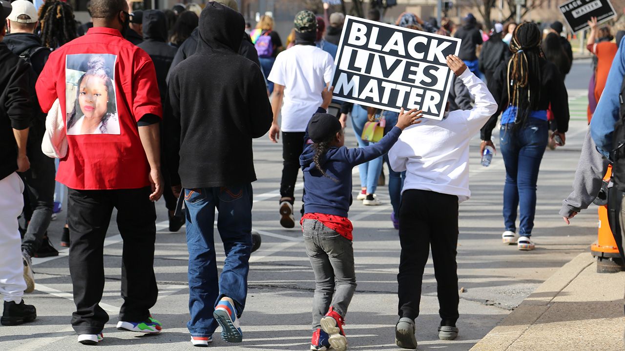 Kids hold up a sign that reads, "Black Lives Matter," in Louisville, Kentucky. Photo: Laurin-Whitney Gottbrath