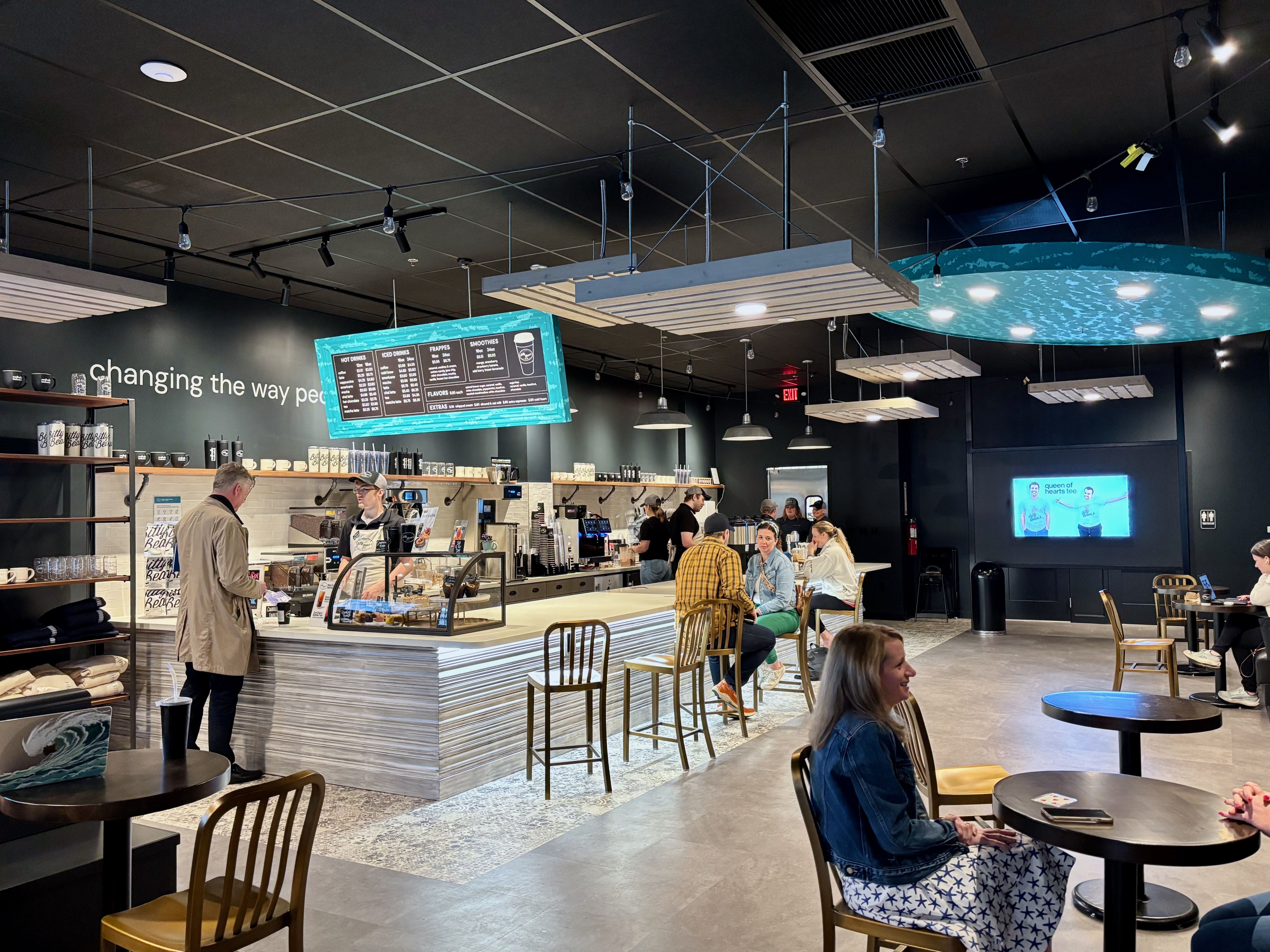An overview of the Bitty & Beau's cafe counter and dining area, a sleek and modern-looking space