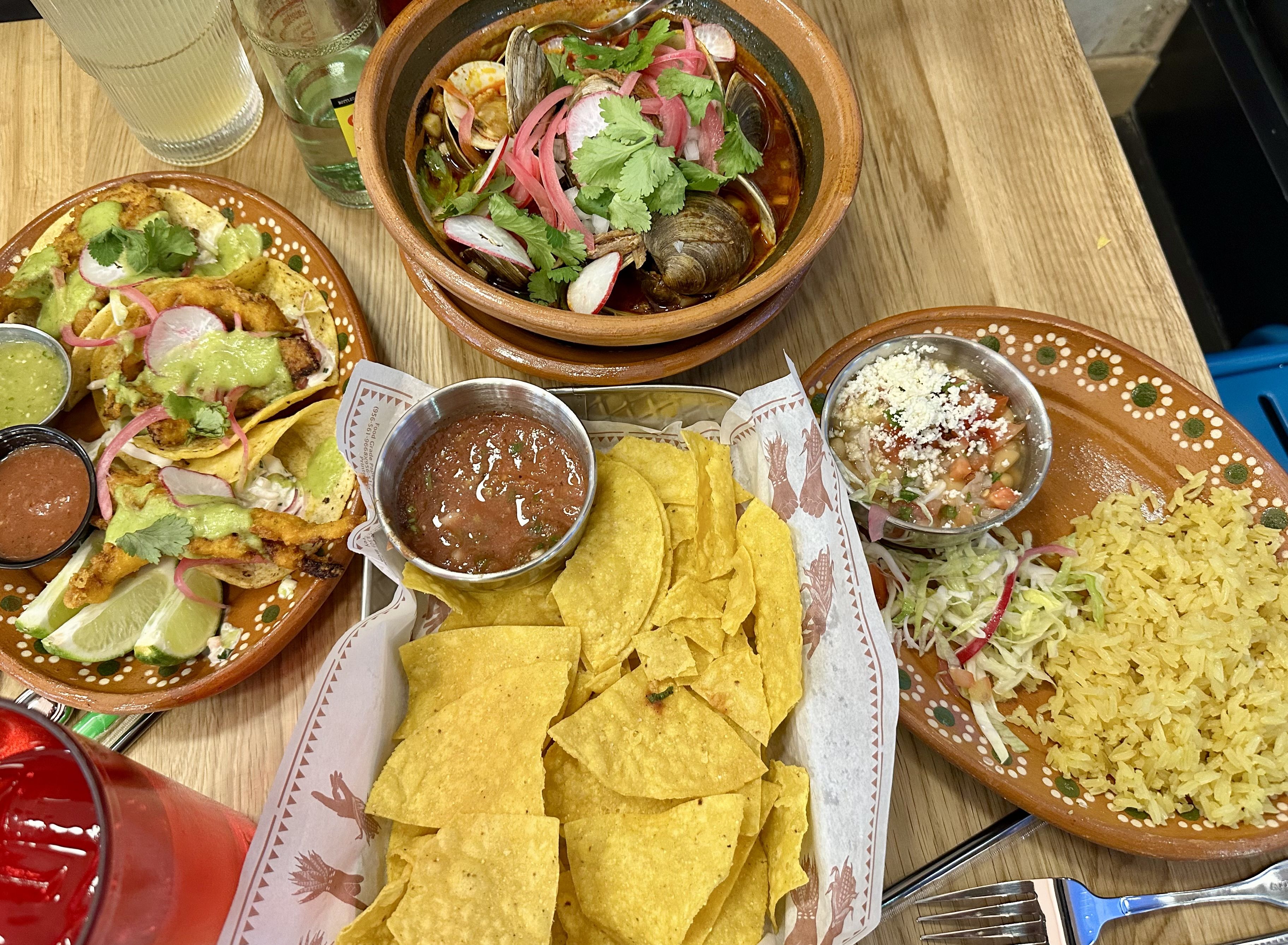 Several Mexican dishes on a table