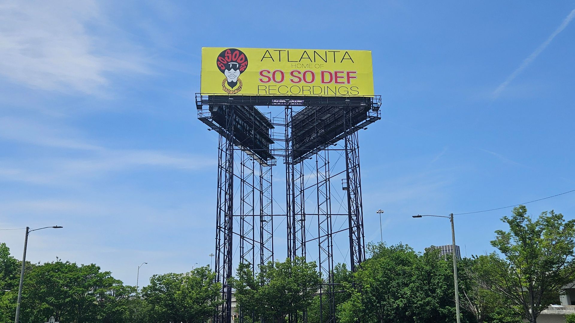 A billboard that reads "Atlanta Home of So So Def Recordings" with the record label's logo on the left.