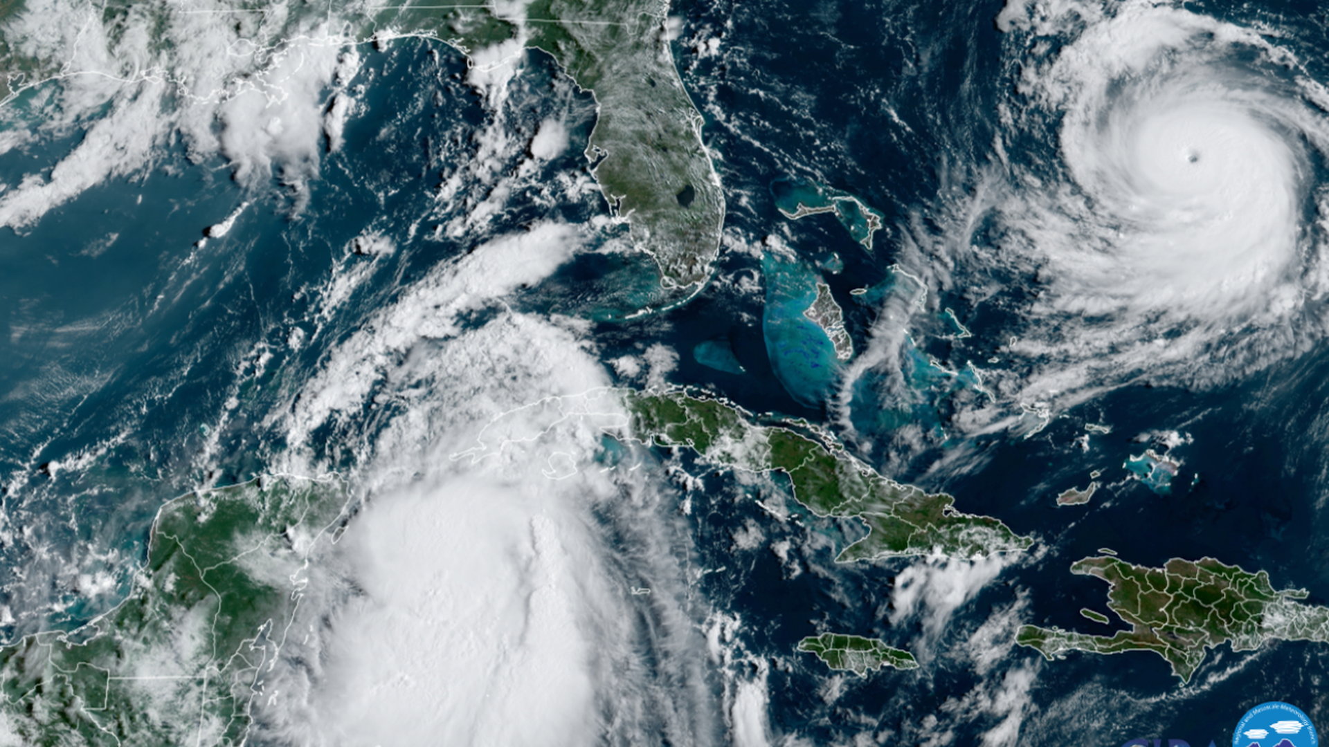 Tropical Storm Idalia (left) approaching Florida next to Hurricane Franklin (right) seen from a satellite on Aug. 28.