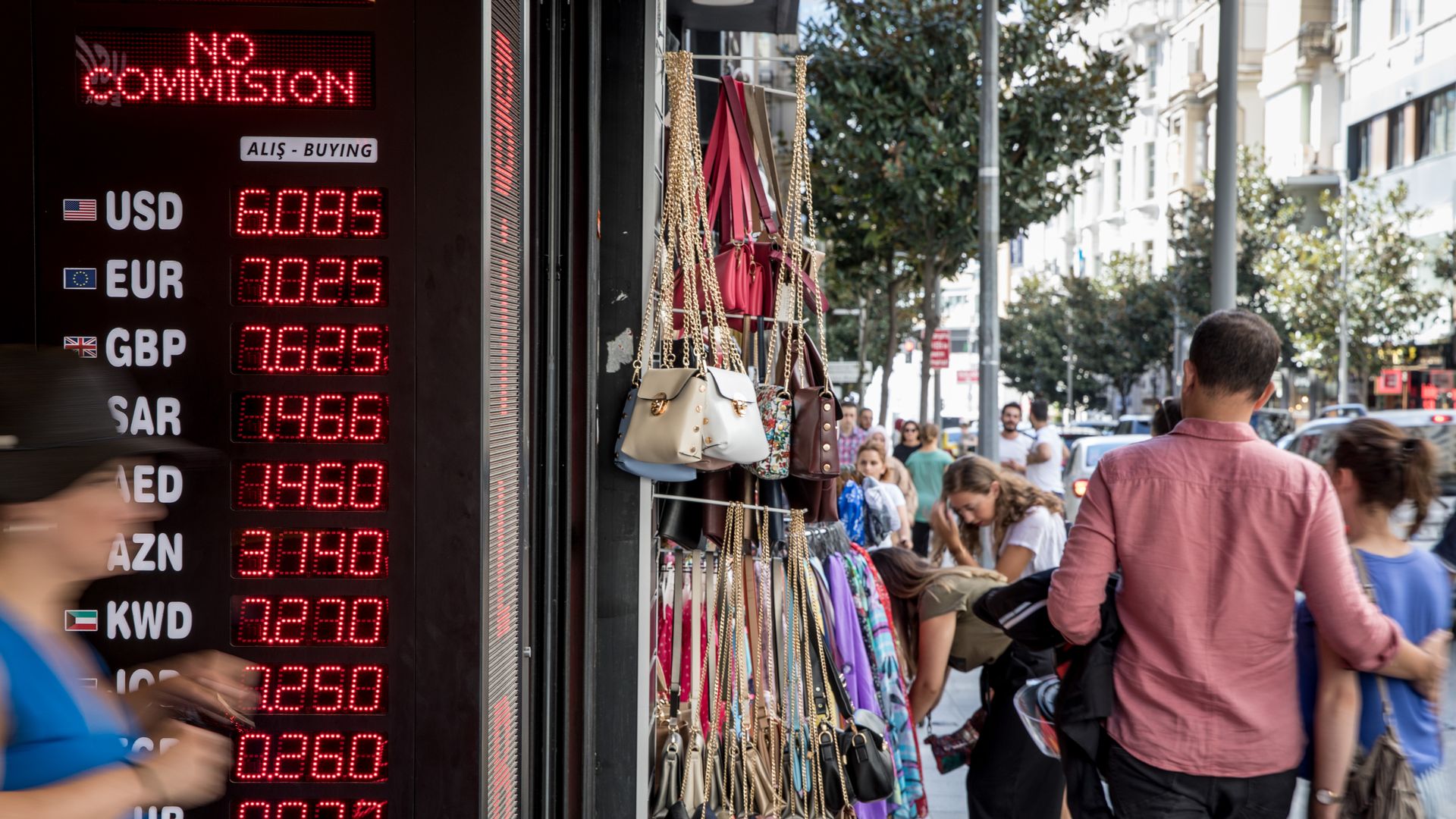 People walk past a currency exchange shop on August 14, 2018 in Istanbul, Turkey.
