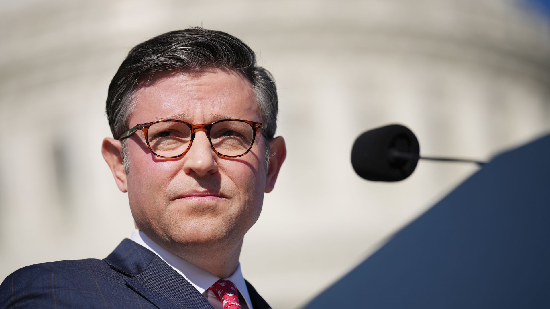 House Speaker Mike Johnson speaks at a press conference in front of the Capitol