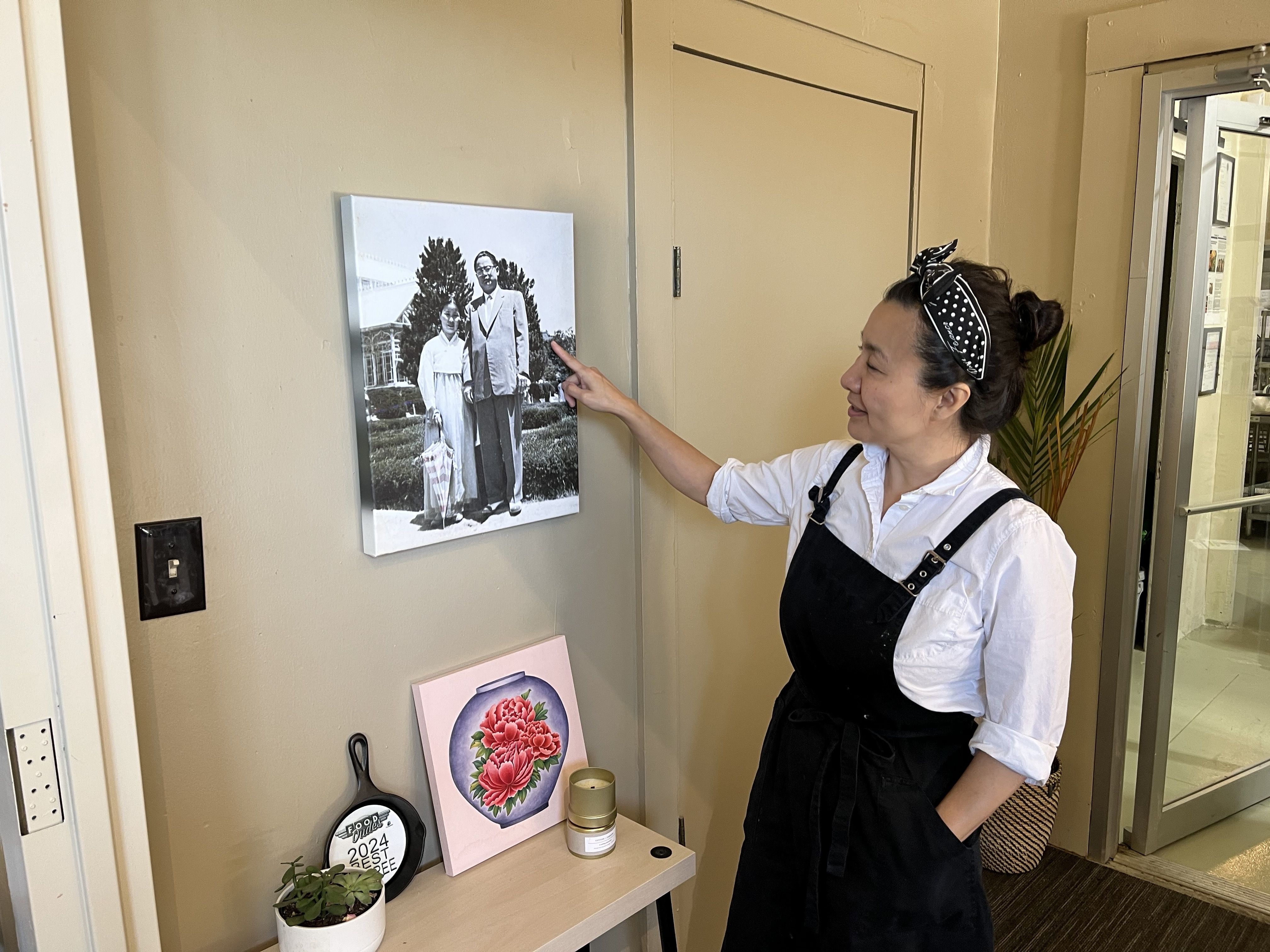 A chef shows a photo of her relatives.
