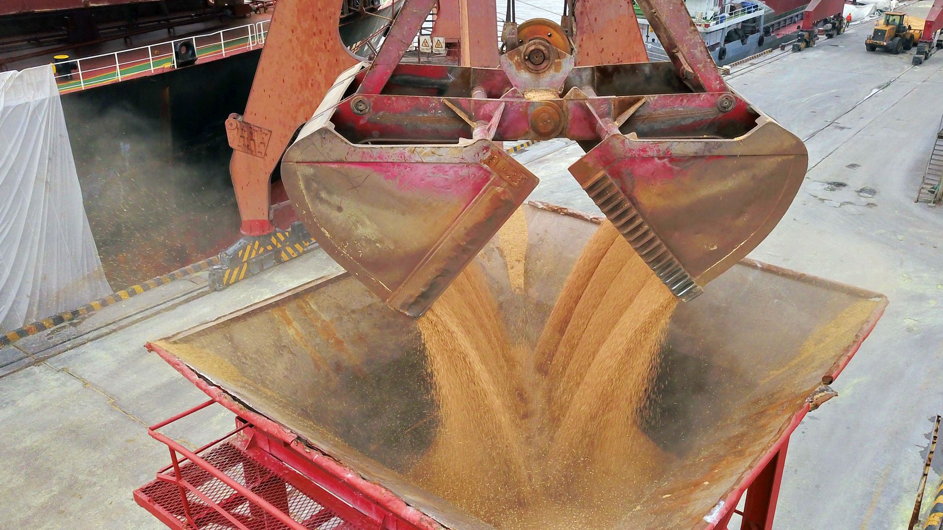 A crane unloads soybeans imported from Brazil at Nantong Port on August 21, 2018 in Nantong, Jiangsu Province of China.