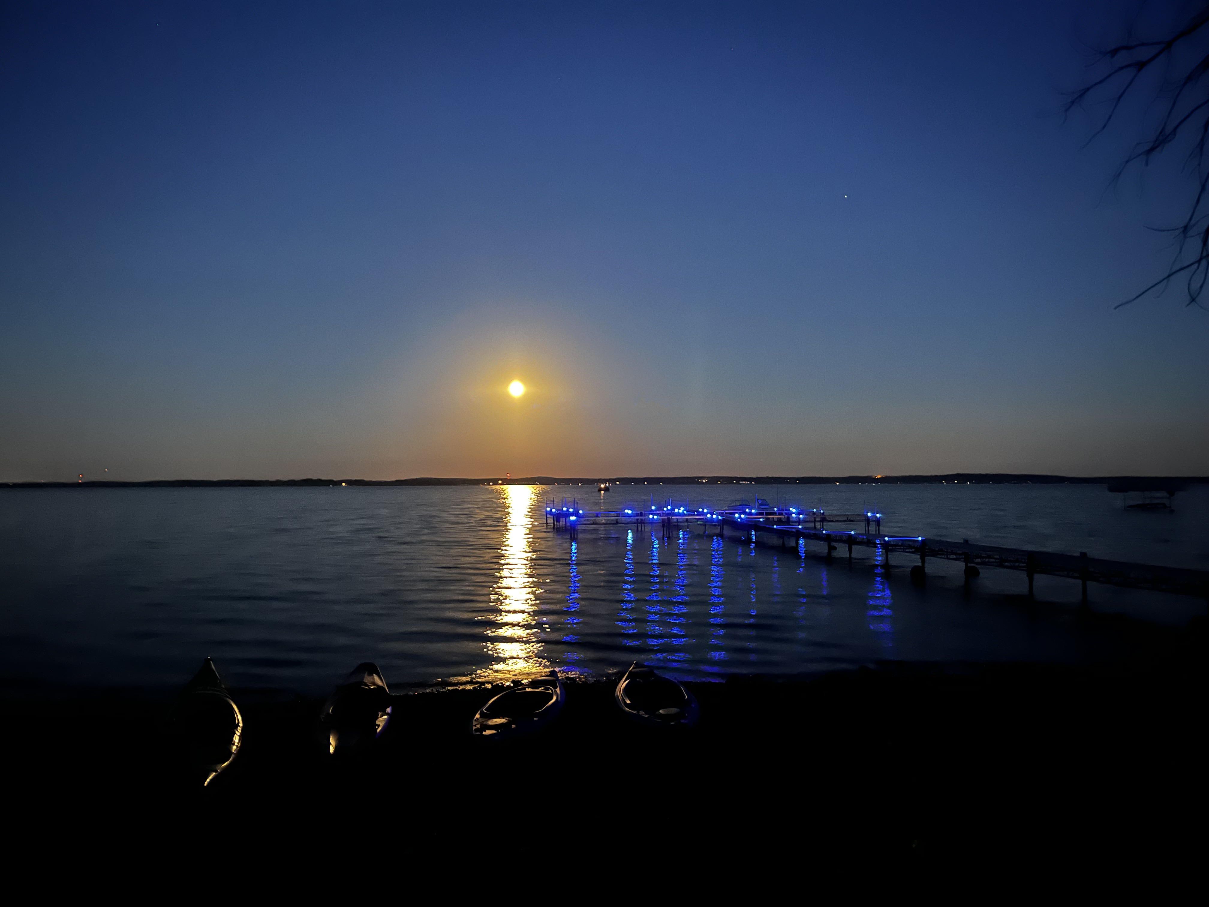Moon reflected on a lake at night
