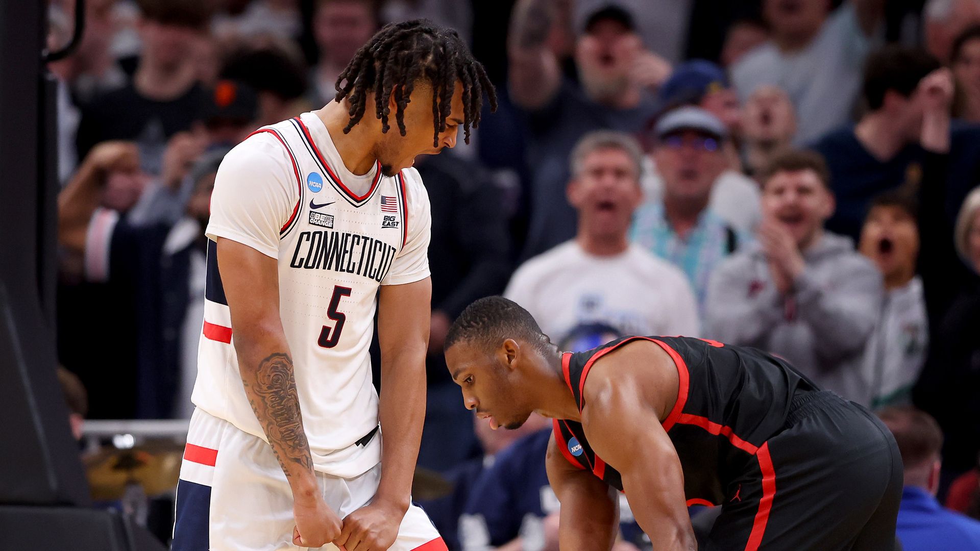 UConn celebrates during a victory over SDSU