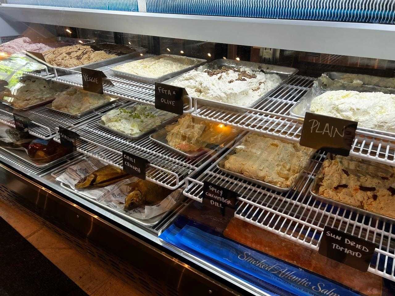 A display case of schmears at Benji's Bagel & Coffee House