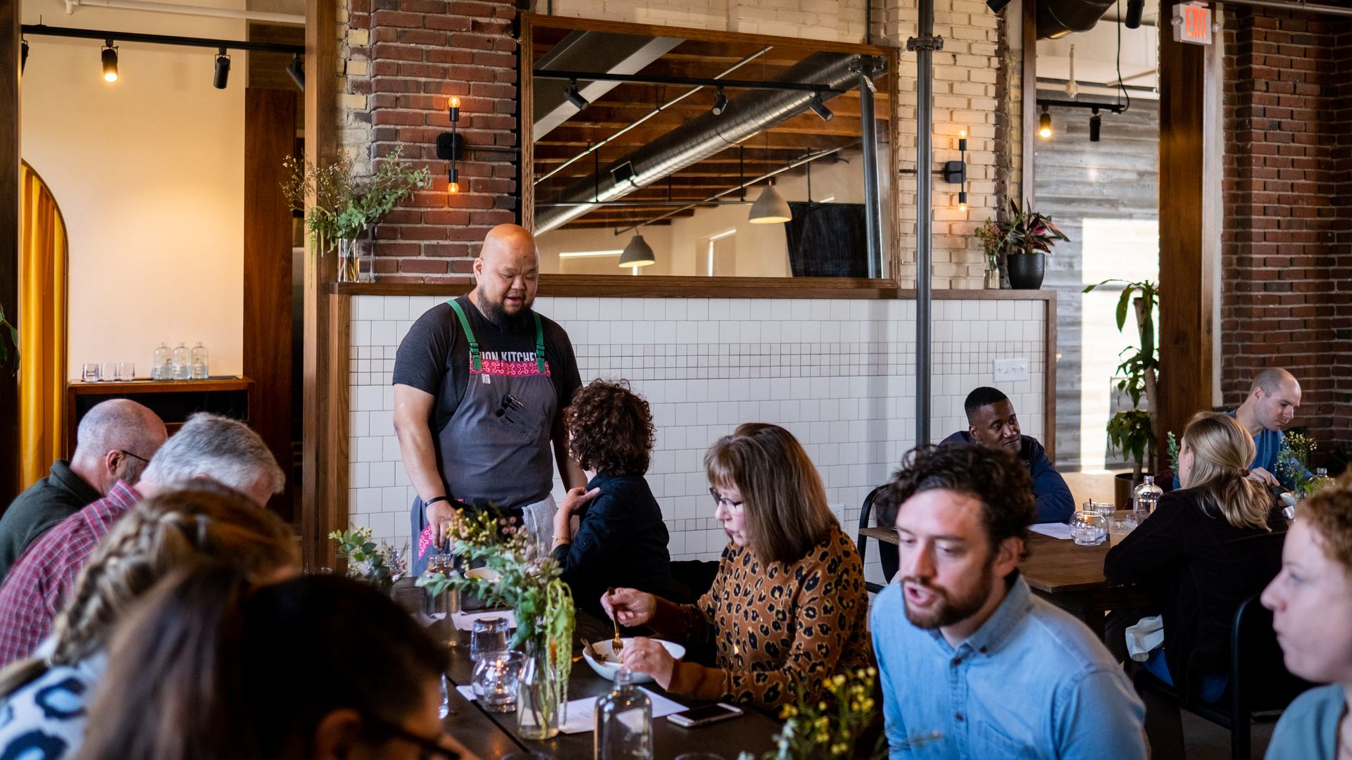 A group of people dining at a restaurant.