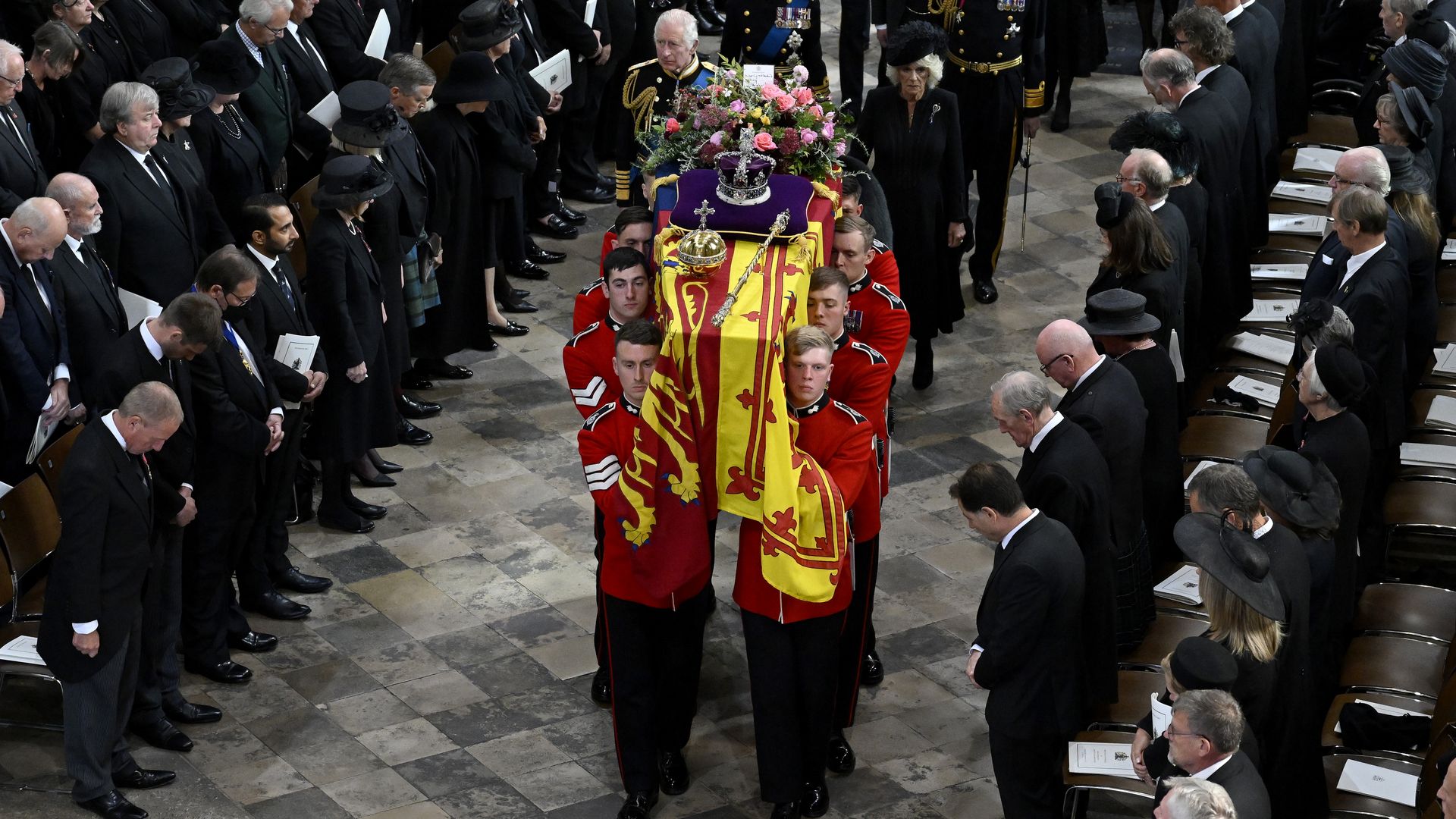 The coffin of Queen Elizabeth II with the Imperial State Crown resting on top of it departs Westminster Abbey during the state funeral of Queen Elizabeth II.