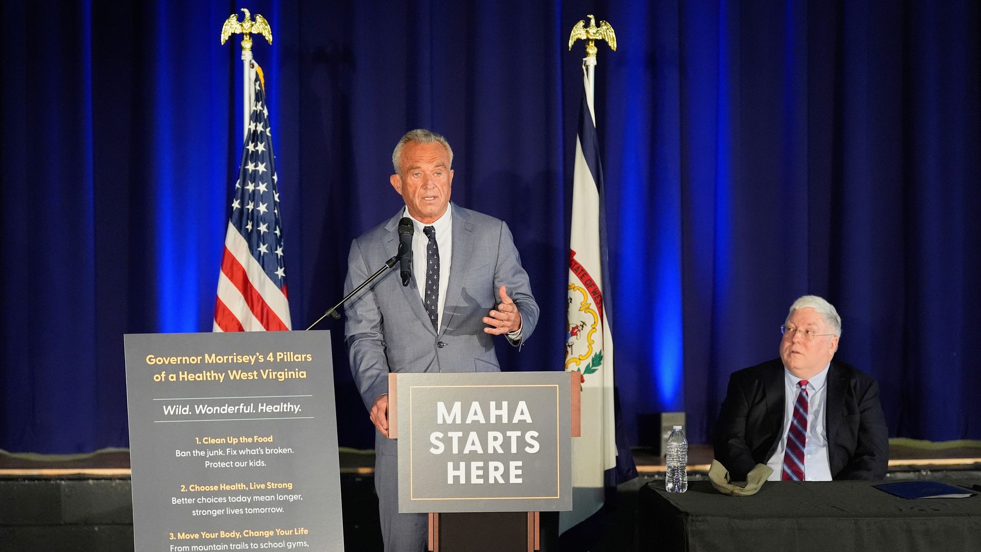 Kennedy speaks as Morrisey observes