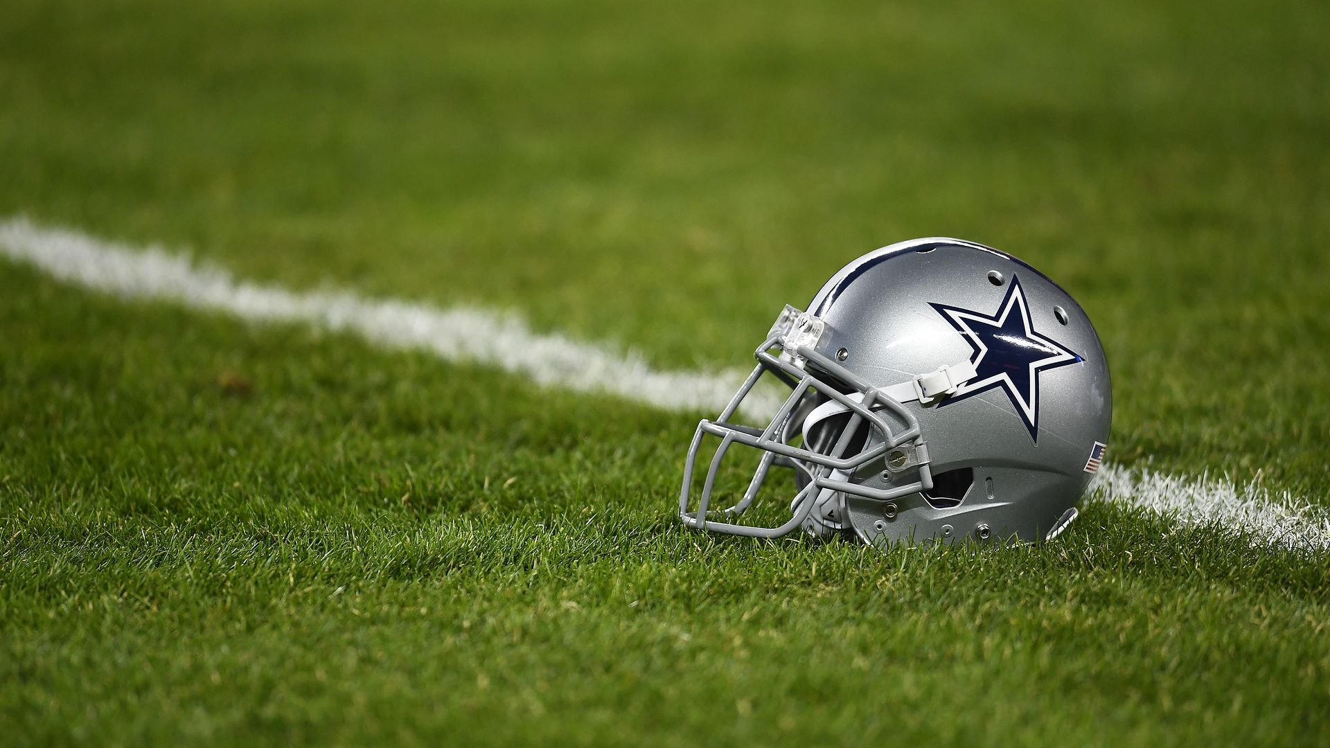 Photo of a Dallas Cowboys helmet on field 