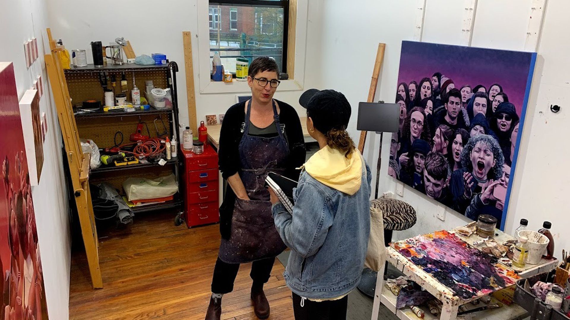 Mary Henderson, left, standing in her studio. Photo courtesy of Michael Mergen/Center for Emerging Visual Artists.
