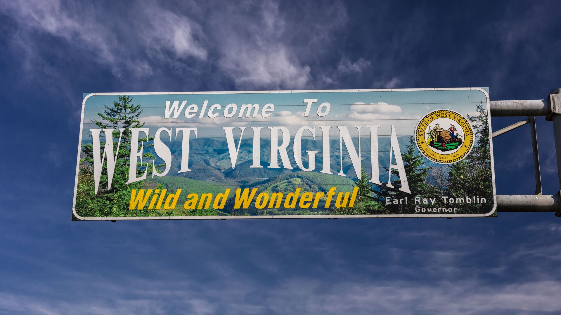 A "Welcome to West Virginia" sign.