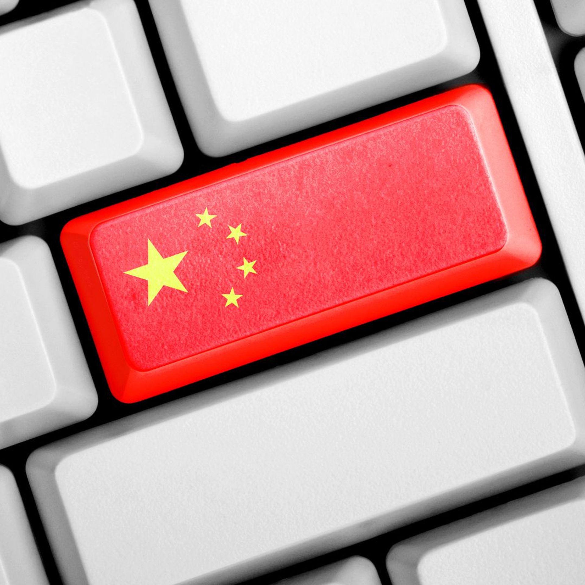 Illustration of a computer keyboard with a red return key resembling China's flag 