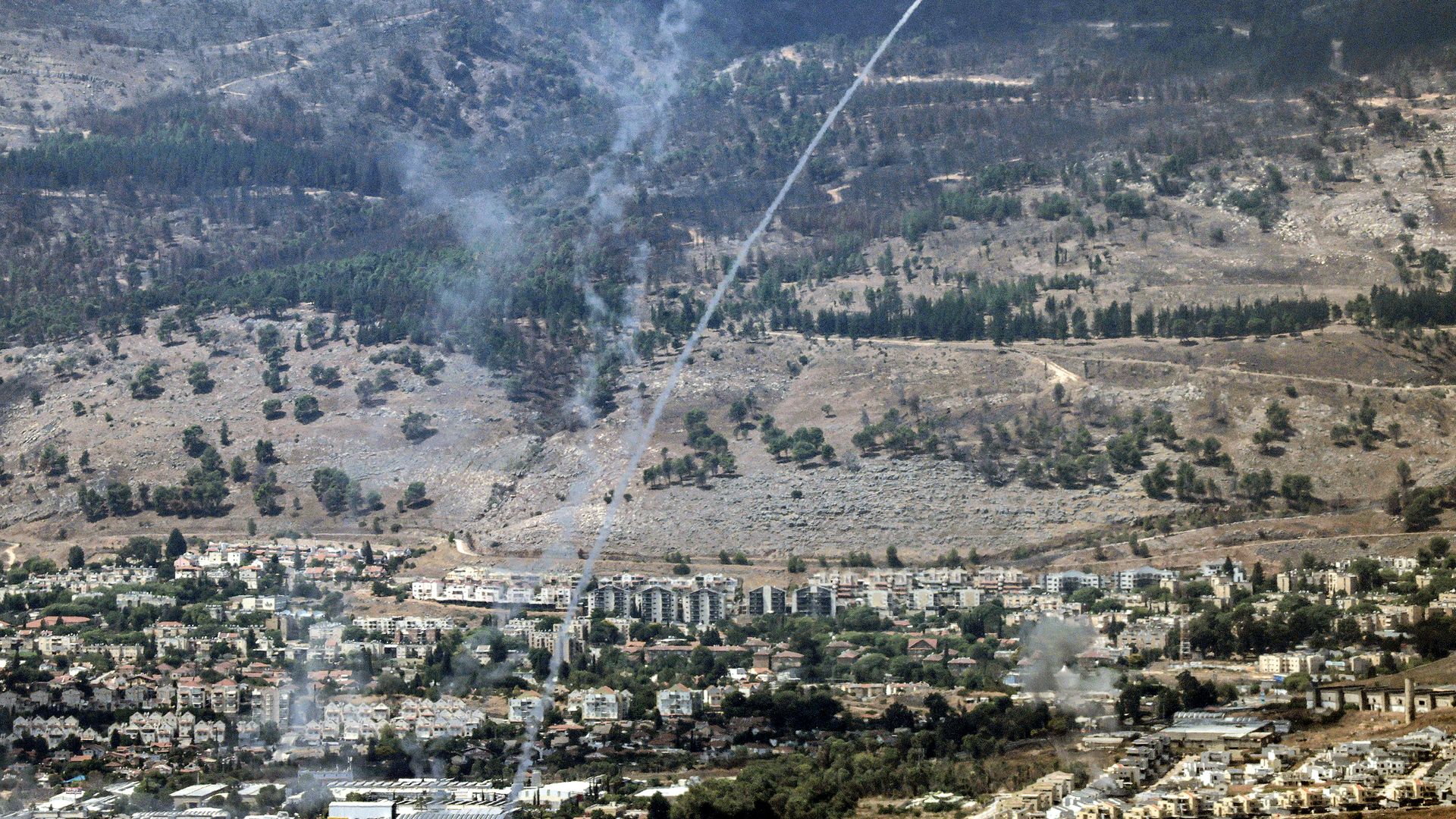 Rockets fired from southern Lebanon are intercepted by Israel's Iron Dome air defence system over the Upper Galilee region in northern Israel on September 4, 2024. 