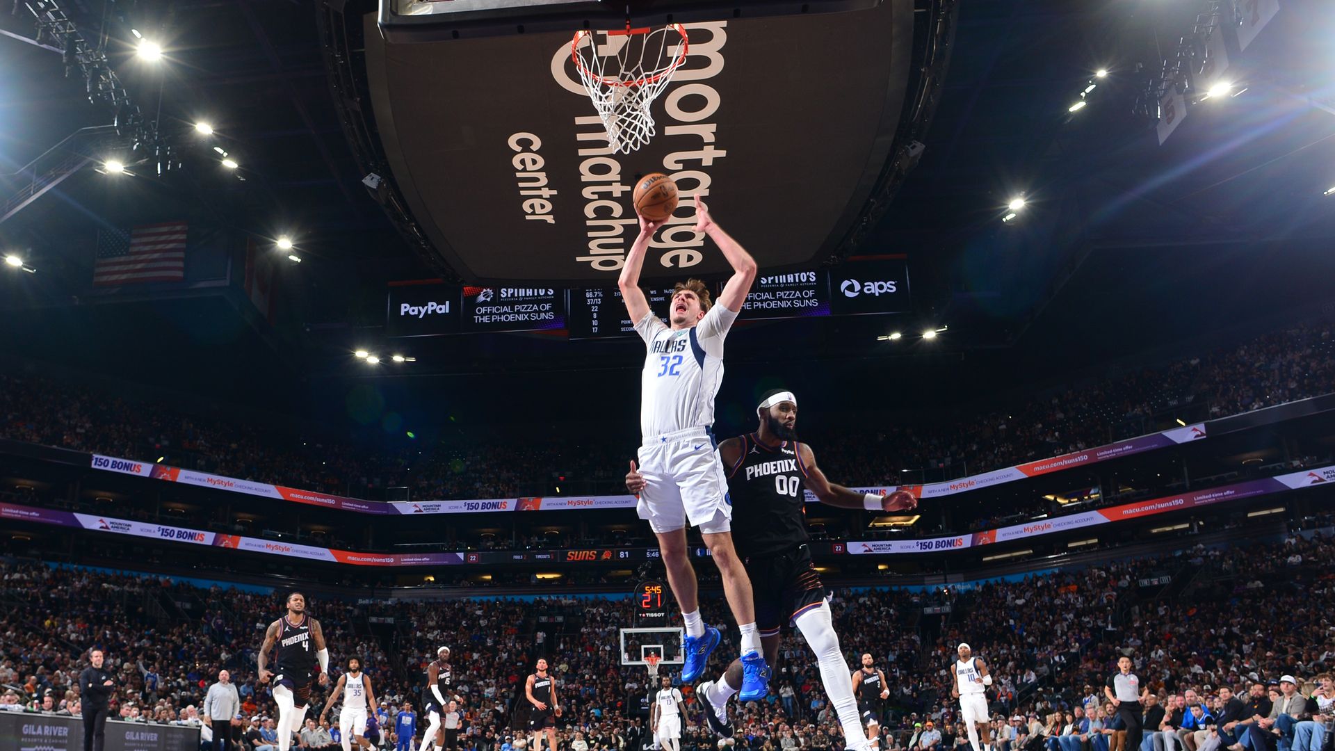 Cooper Flagg #32 of the Dallas Mavericks drives to the basket during the game against the Phoenix Suns on February 10, 2026 at PHX Arena in Phoenix, Arizona. 