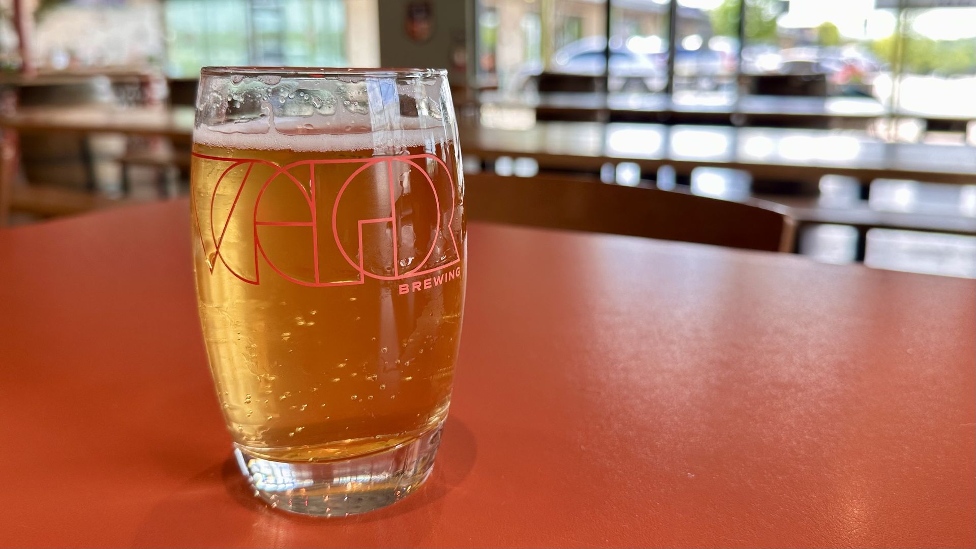 a photo of a smaller beer on a table 