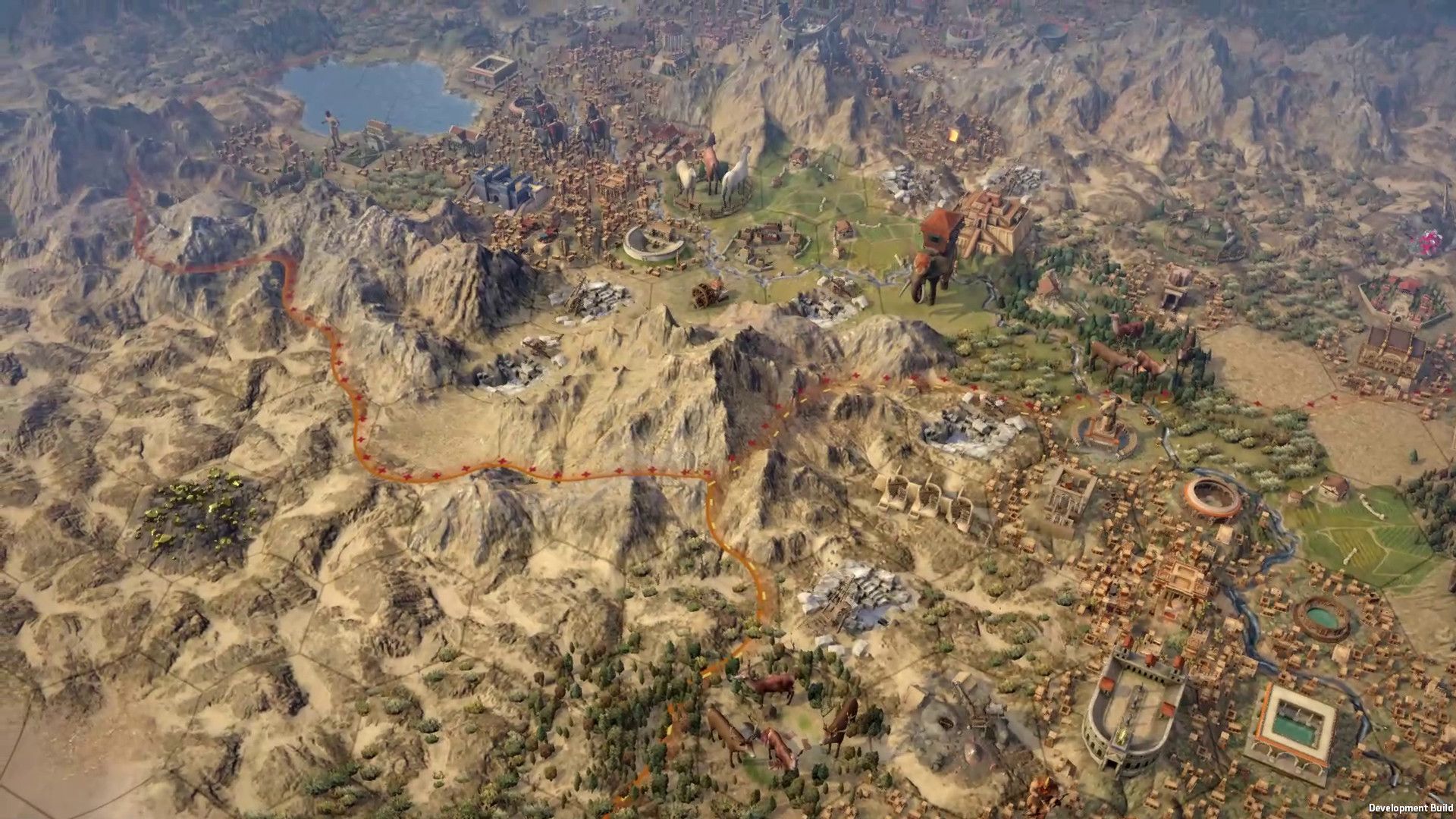 Video game screenshot of a bird's eye view of a mountain range and a city next to it.