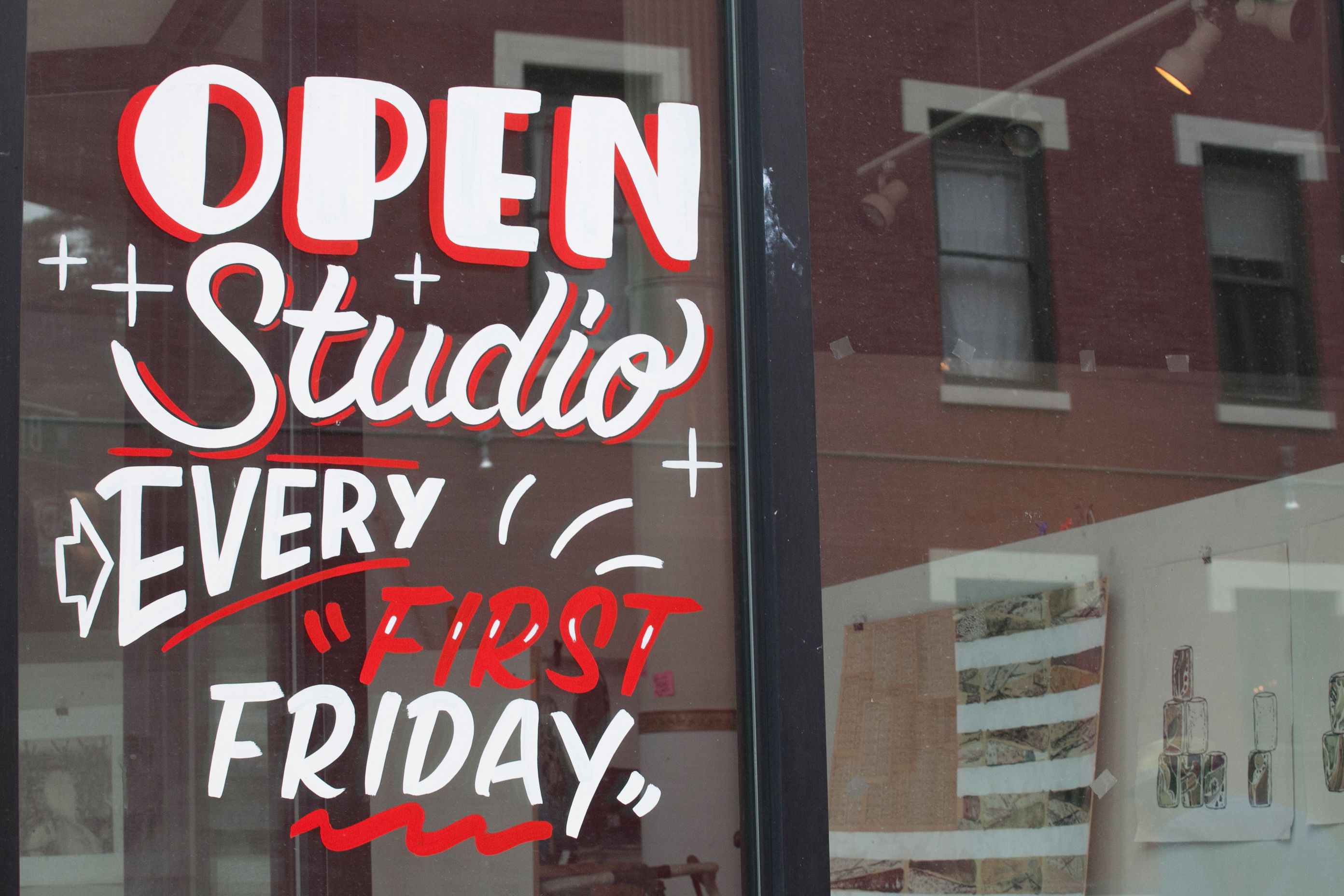a sign that says open studio every first fridays