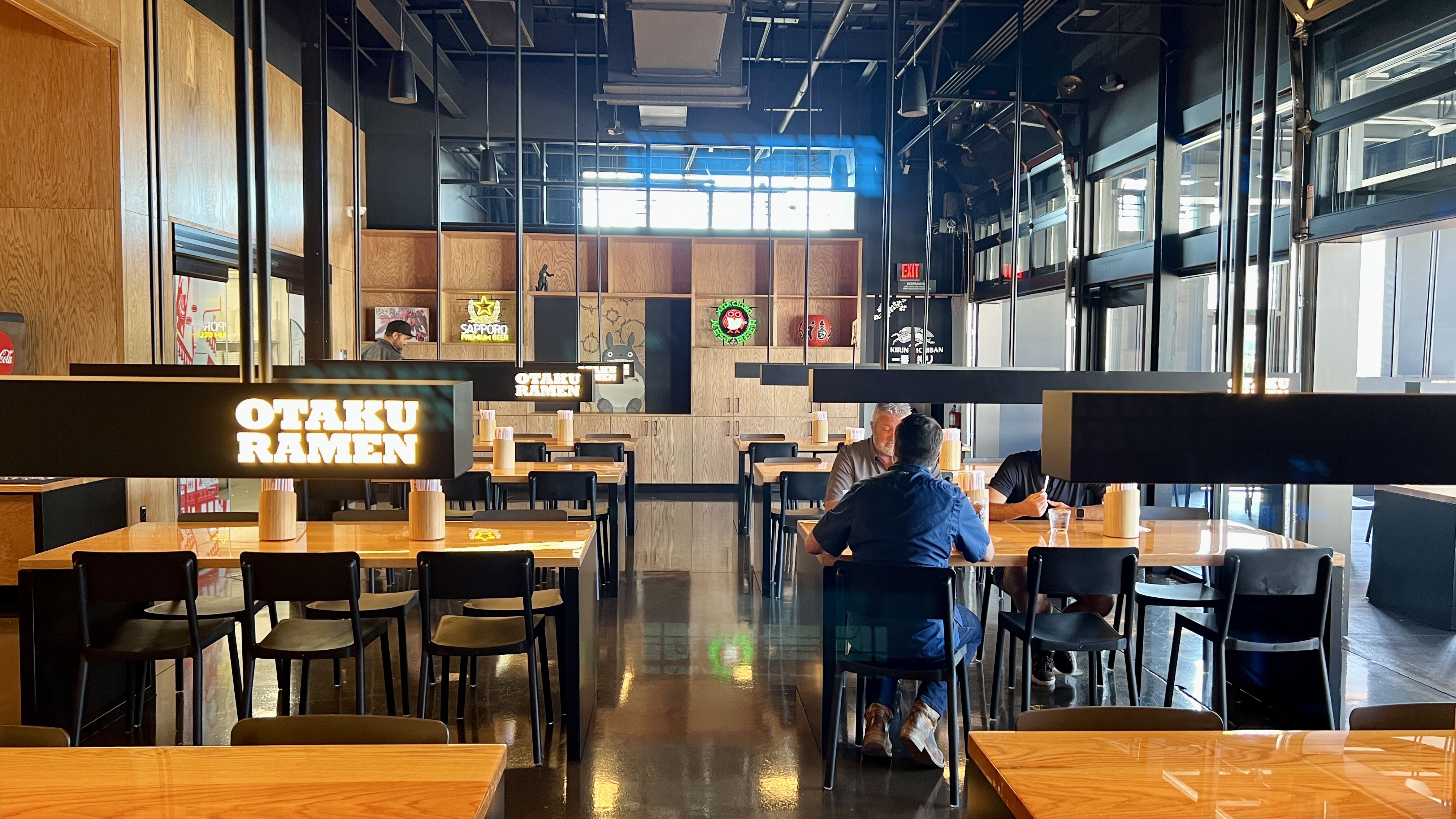long tables fill the dining room of otaku