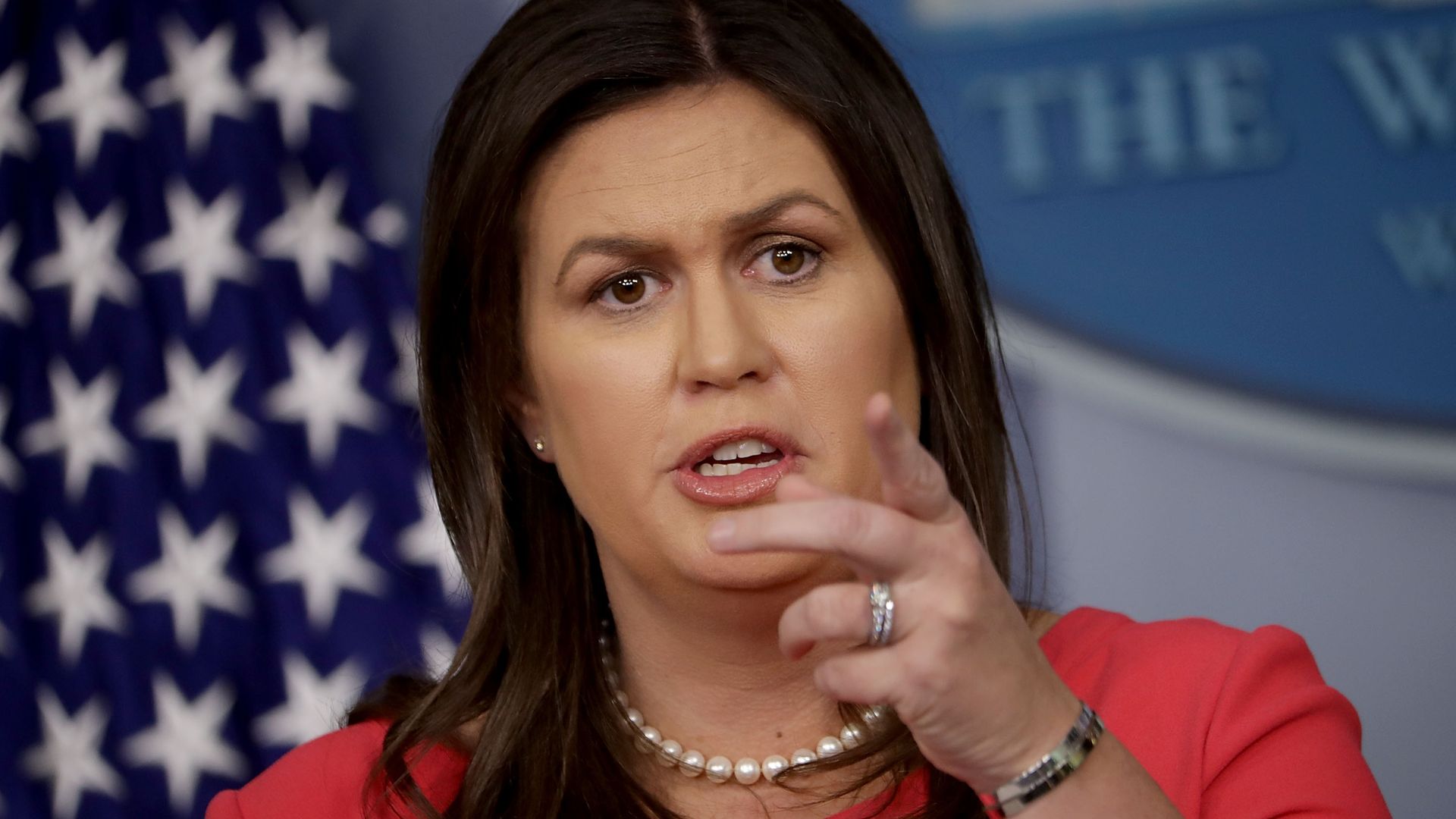 Sanders points during a press briefing 