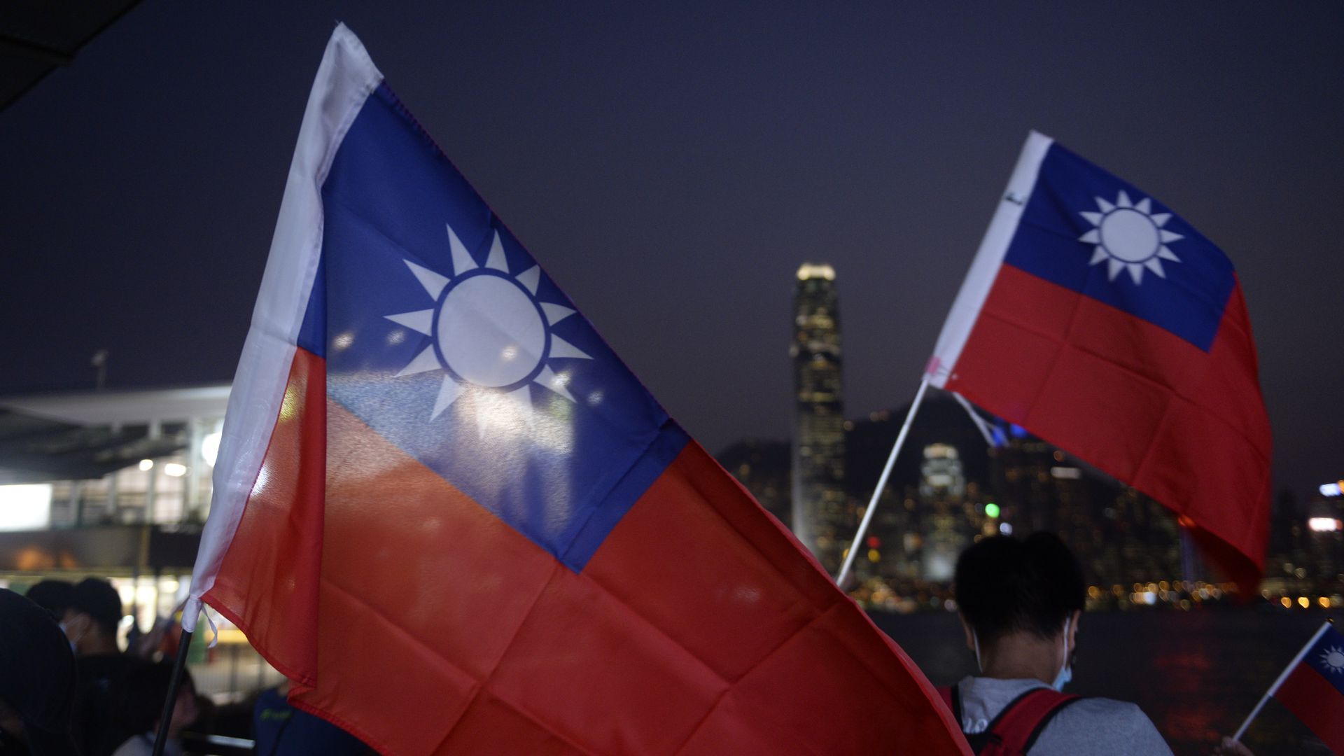 People holding up a Taiwan National Flag in Hong Kong, Oct. 10, 2019.