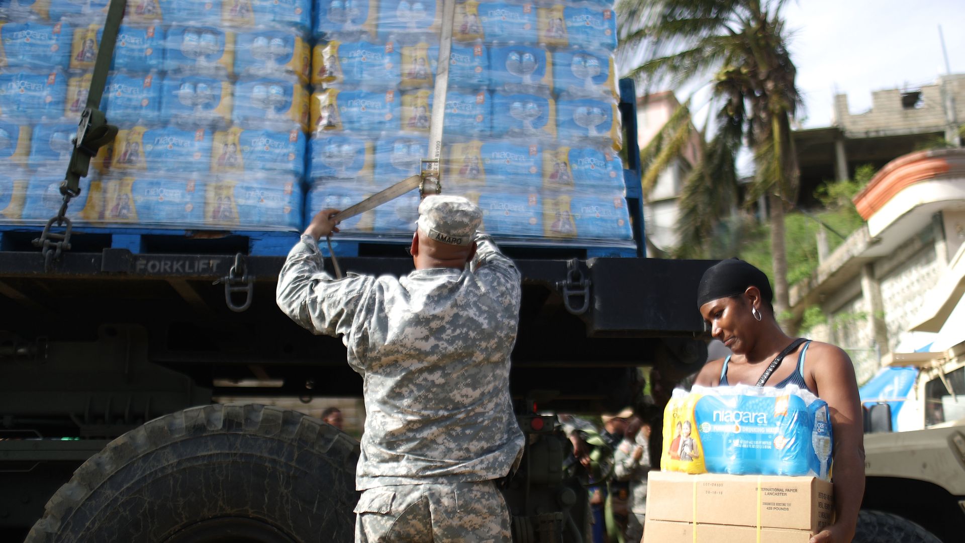 A U.S. Army soldier starts to unload a shipment of water, provided by FEMA on October 17, 2017 in San Isidro, Puerto Rico.