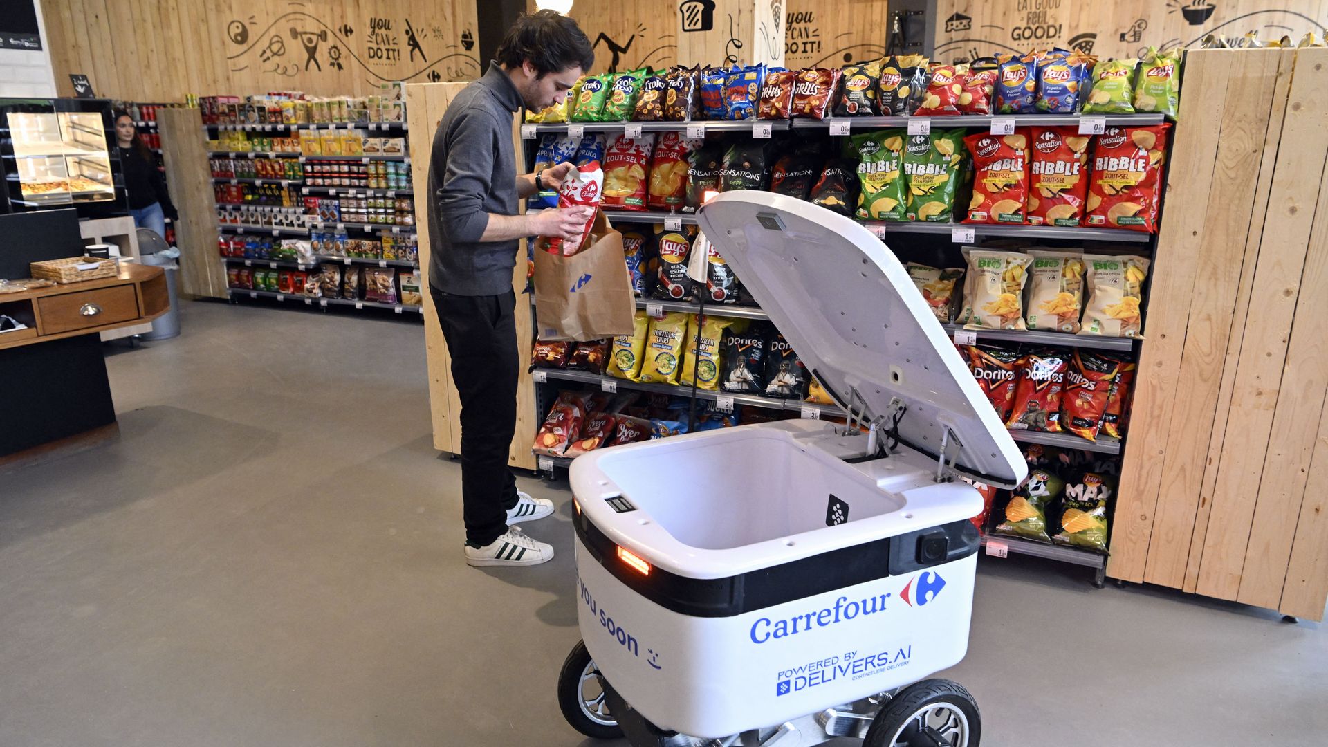 An autonomous robot is packed with groceries to be delivered. 