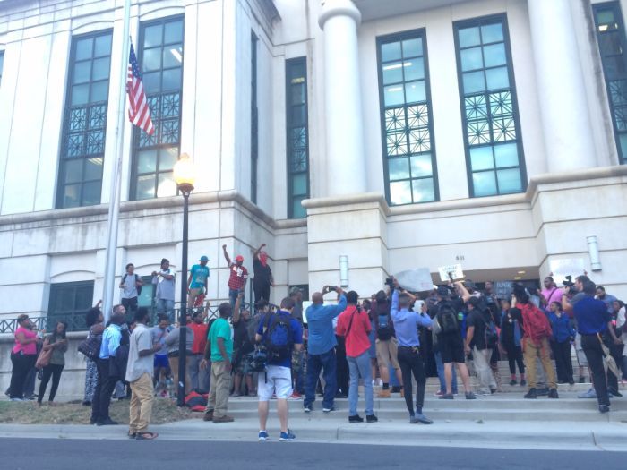 Protestors on the steps of Charlotte-Mecklenburg Police Department