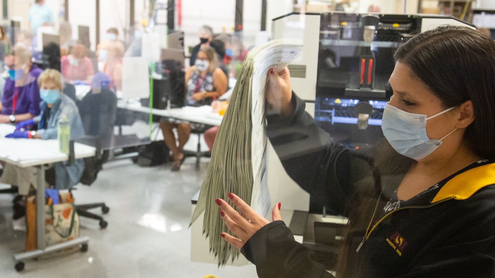 Votes are counted by staff at the Maricopa County Elections Department office on November 5