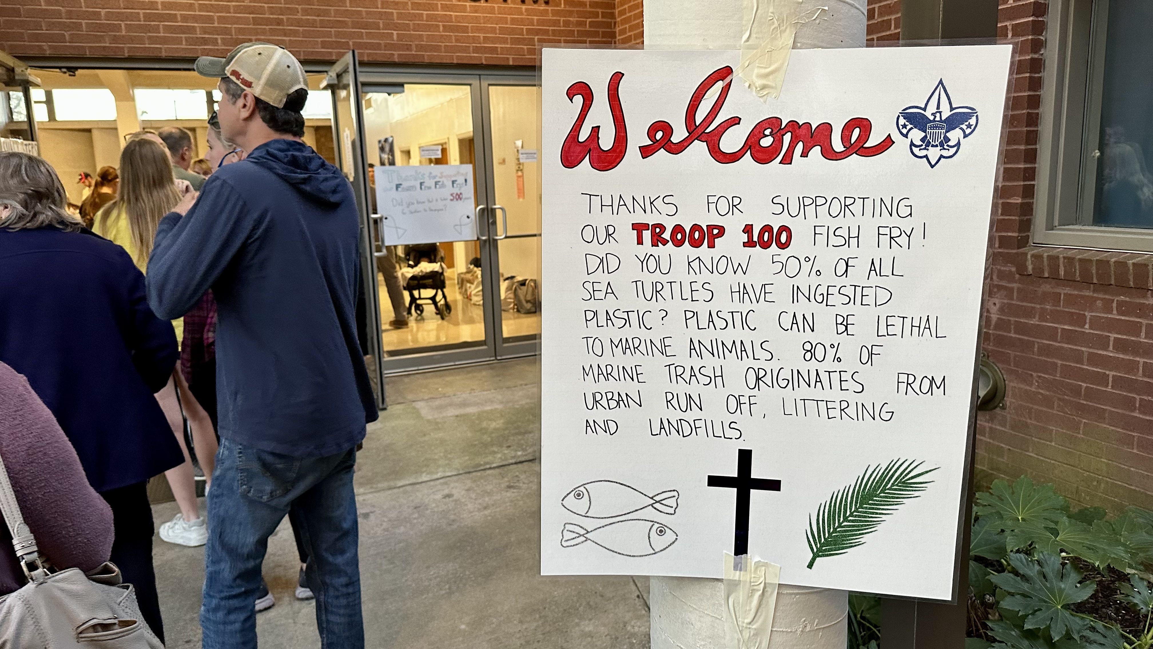 Photo shows a sign talking about the dangers of plastic pollution in the ocean.