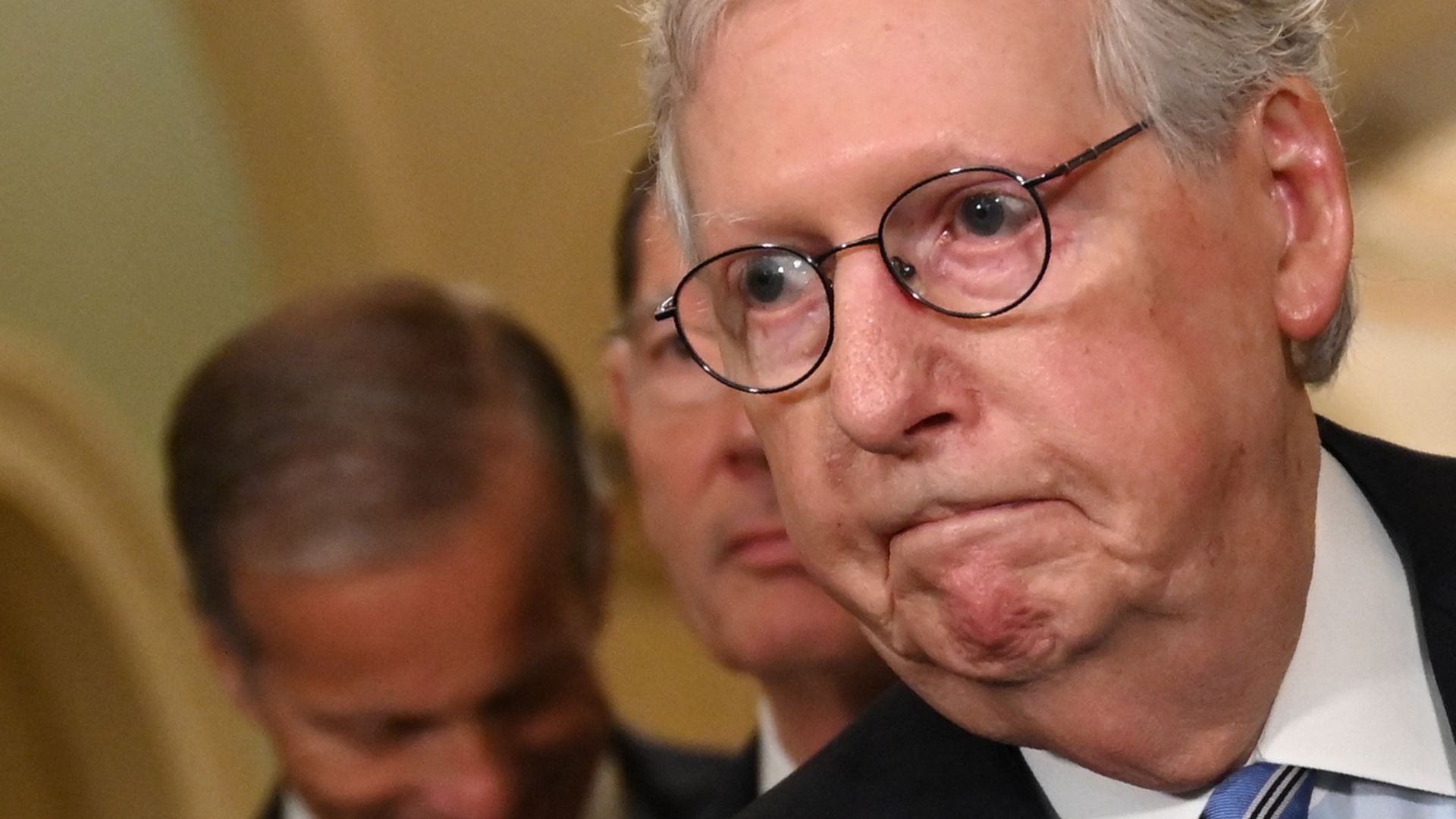 Senate Minority Leader Mitch McConnell is seen speaking with reporters.