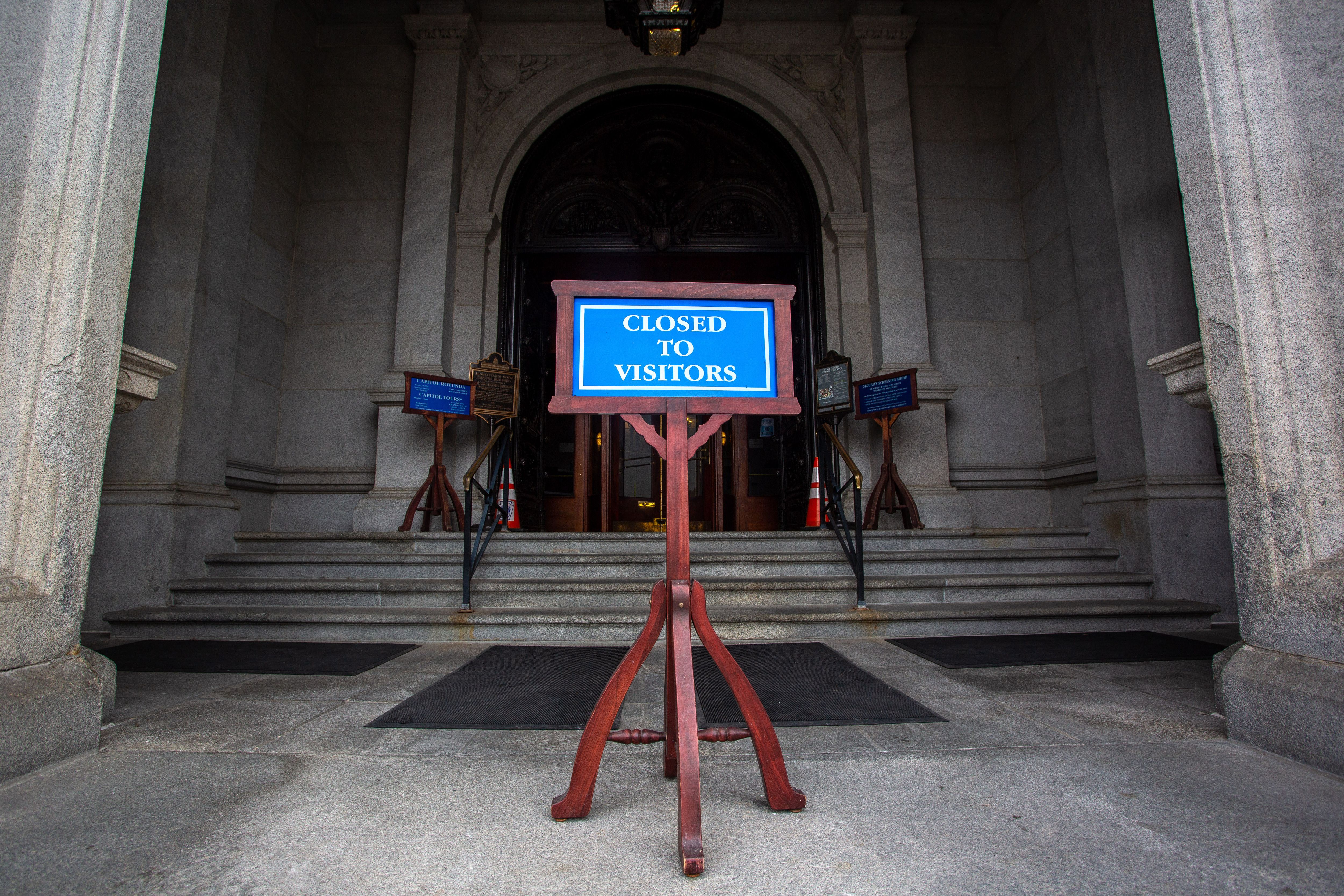  A sign notifies the public that the Pennsylvania State Capitol is closed to visitors. 
