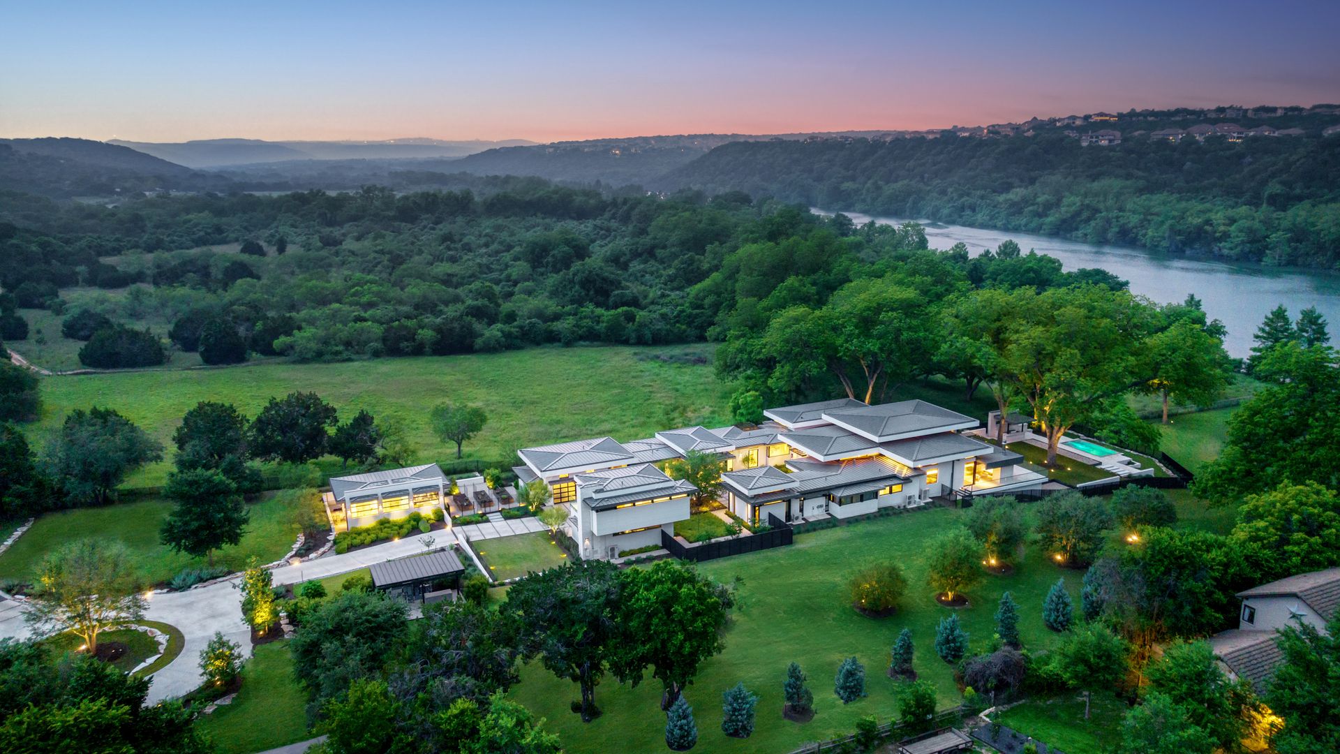 A house sprawls by Lake Austin.