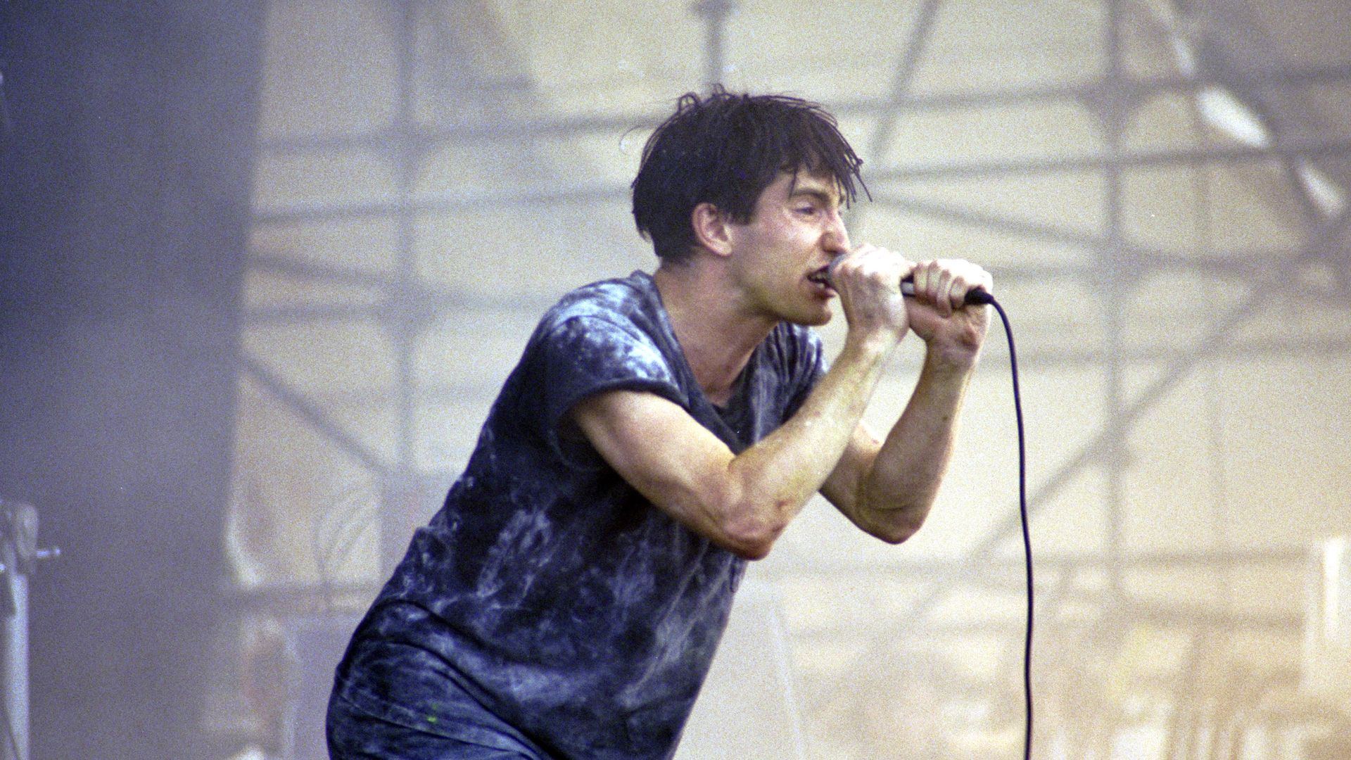 Trent Reznor of Nine Inch Nails performs on stage in 1991.