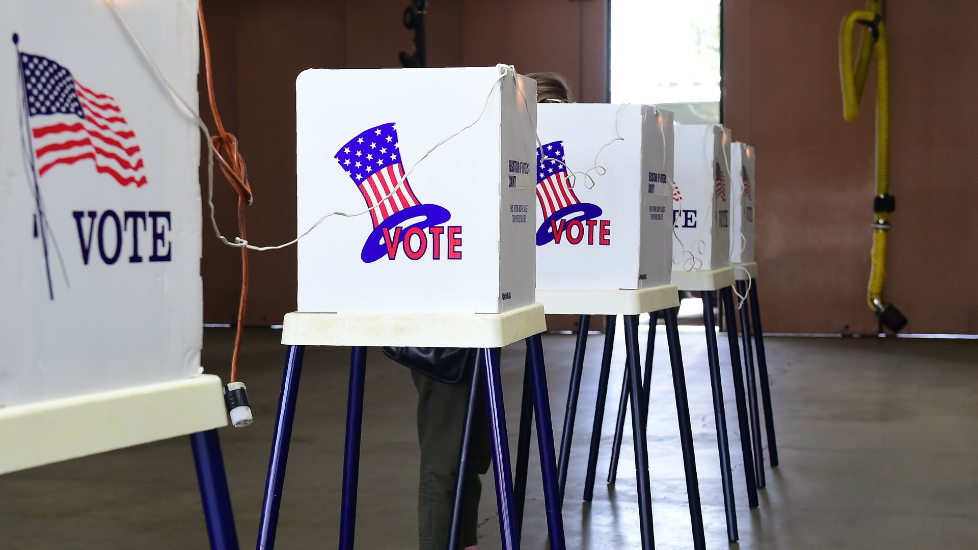 A person in a voting booth