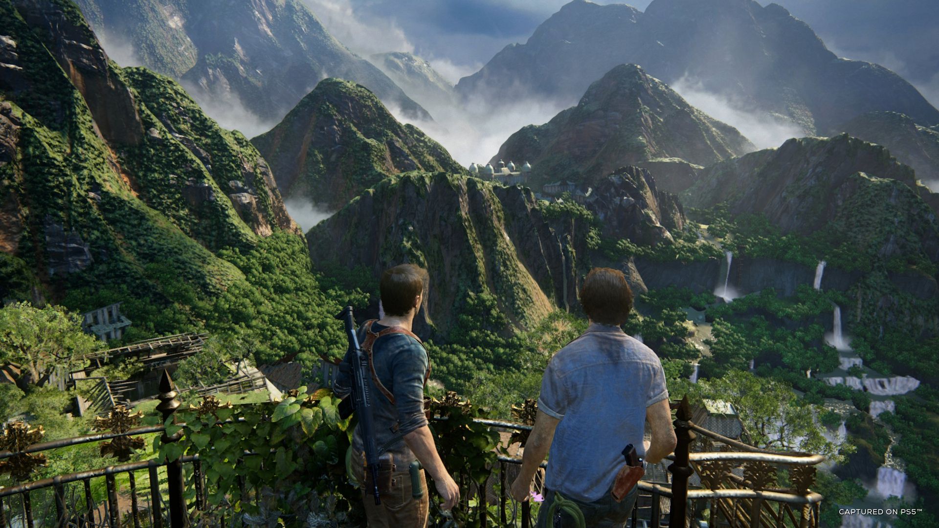 Video game screenshot of two white men viewed from behind, looking out over a valley