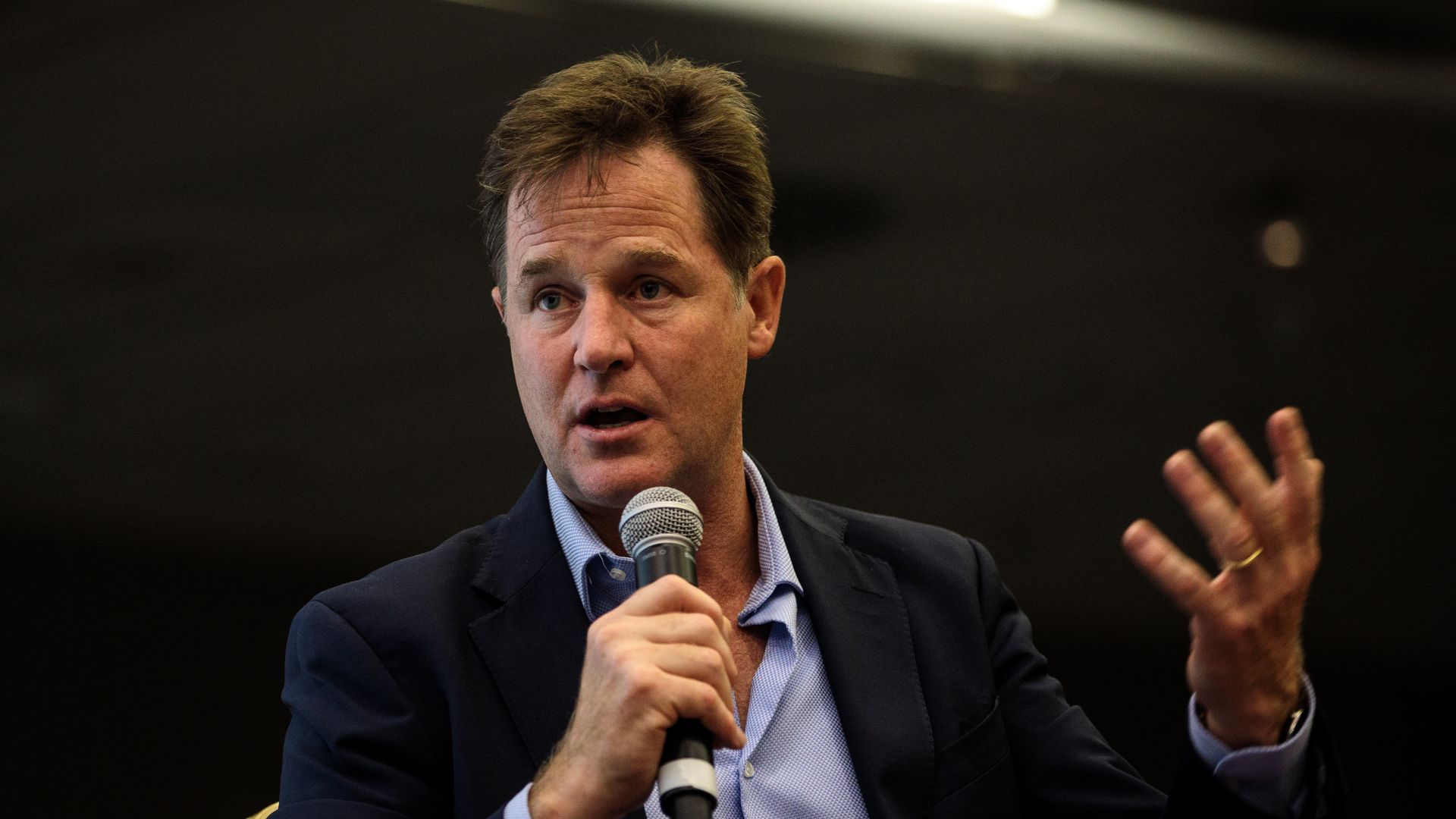 Nick Clegg speaking into a microphone. 