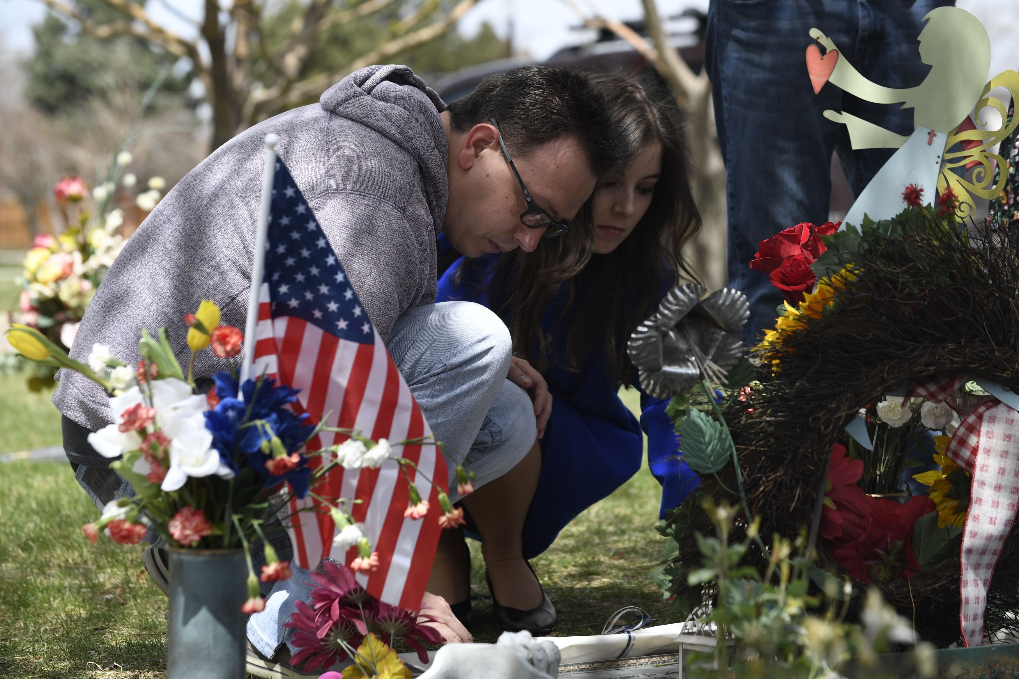  Michael Scott (R) and Marie Sophie (L) visit the grave of his sister, Rachel Scott, at the Chapel Hill Memorial Gardens in Littleton, Colorado.