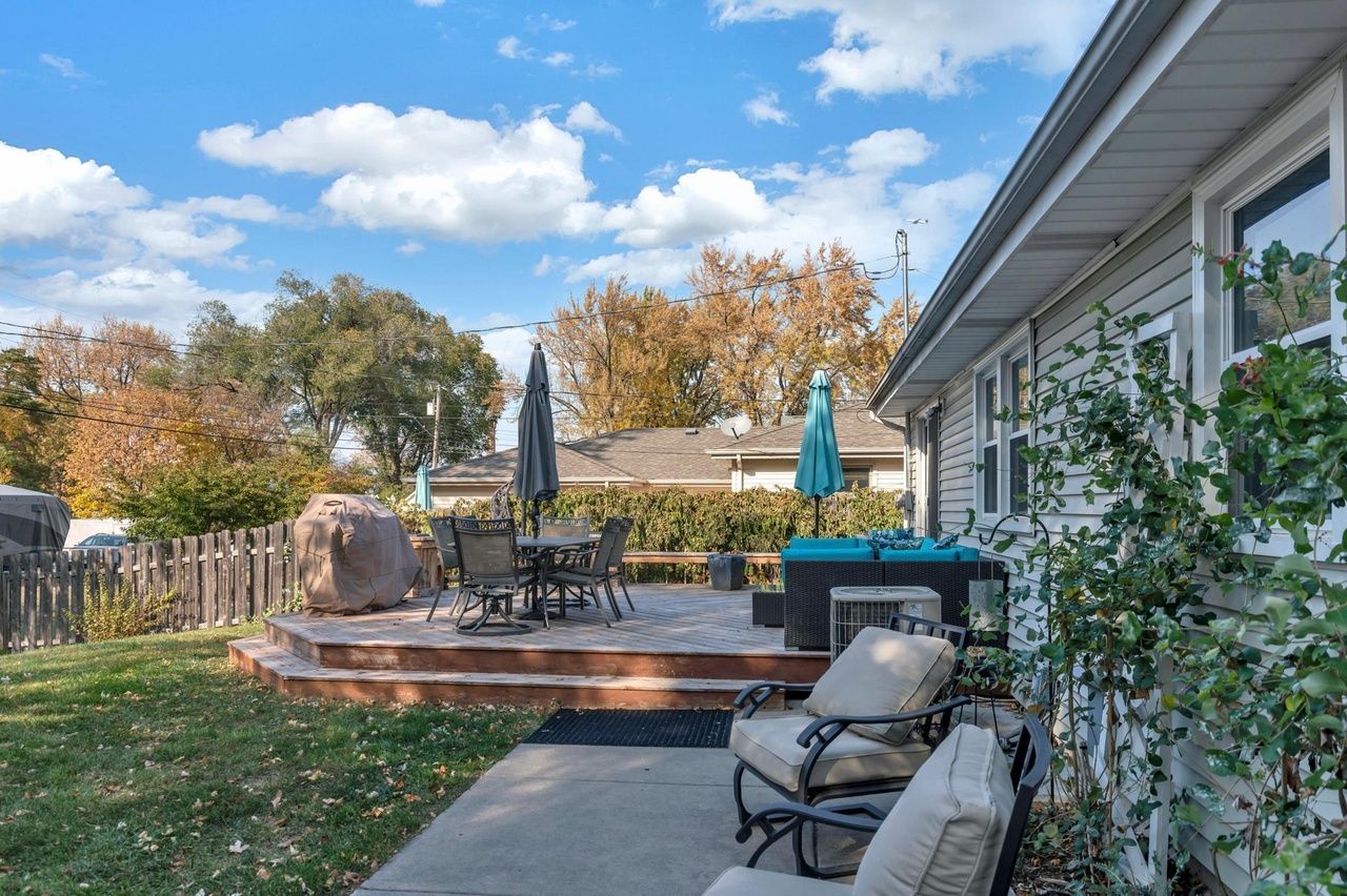 spacious backyard with fence and deck