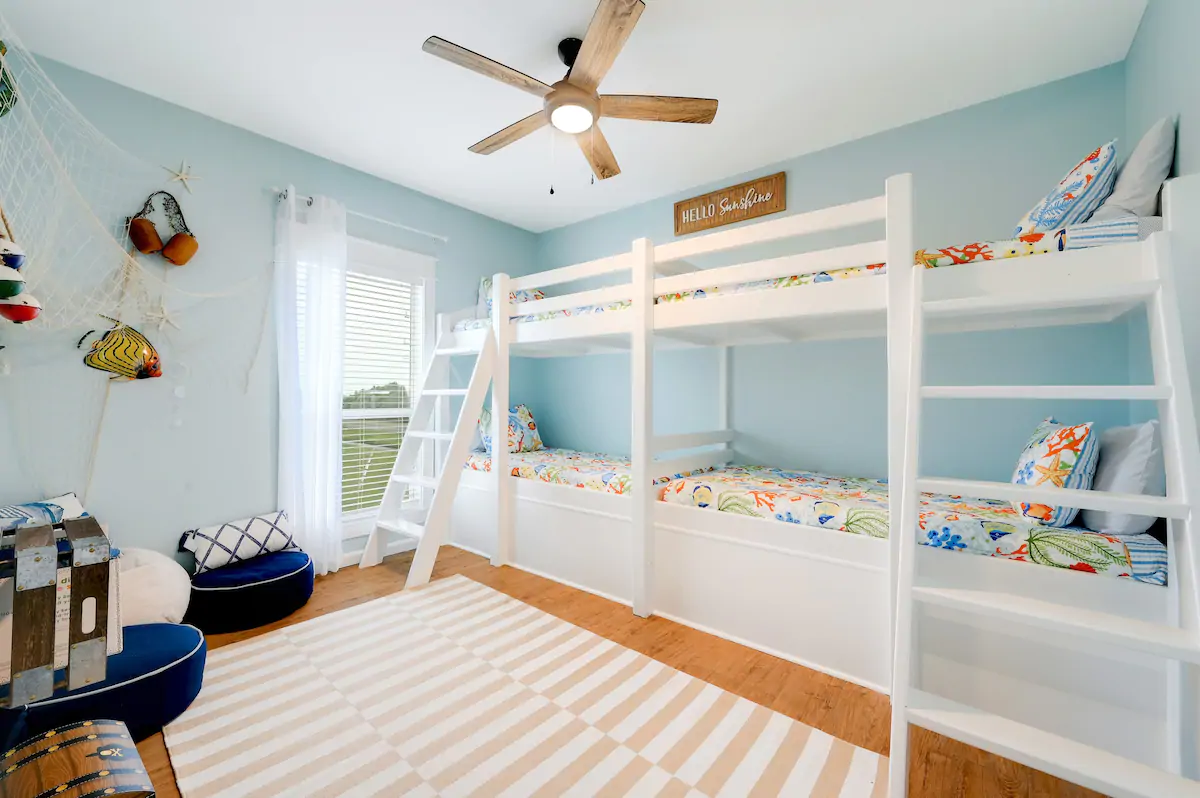 bunk beds with nautical theme in kids bedroom